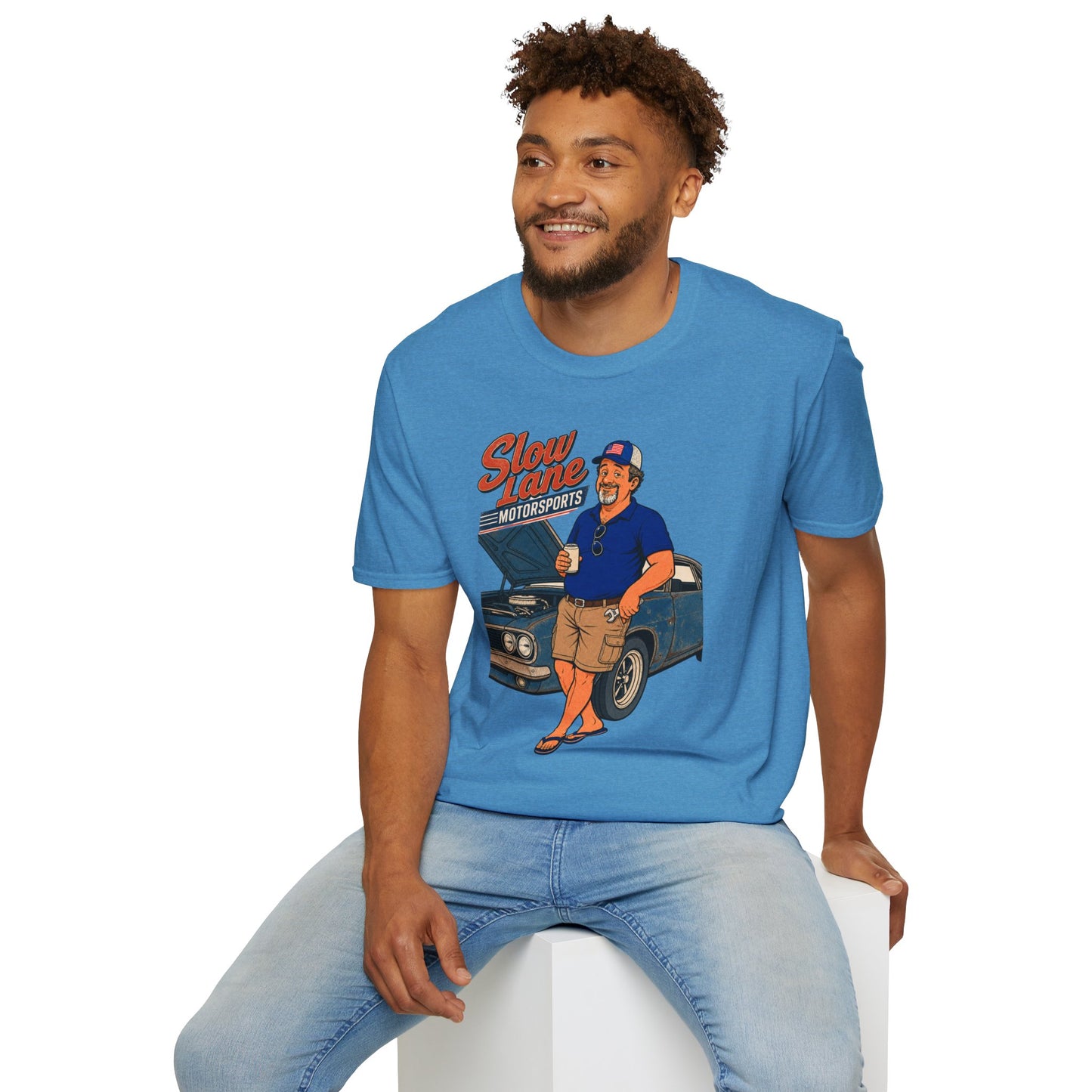 Retro garage-style t-shirt graphic of the Dry Wit dad mascot beside a classic muscle car holding a beer, text reading Slow Lane Motorsports