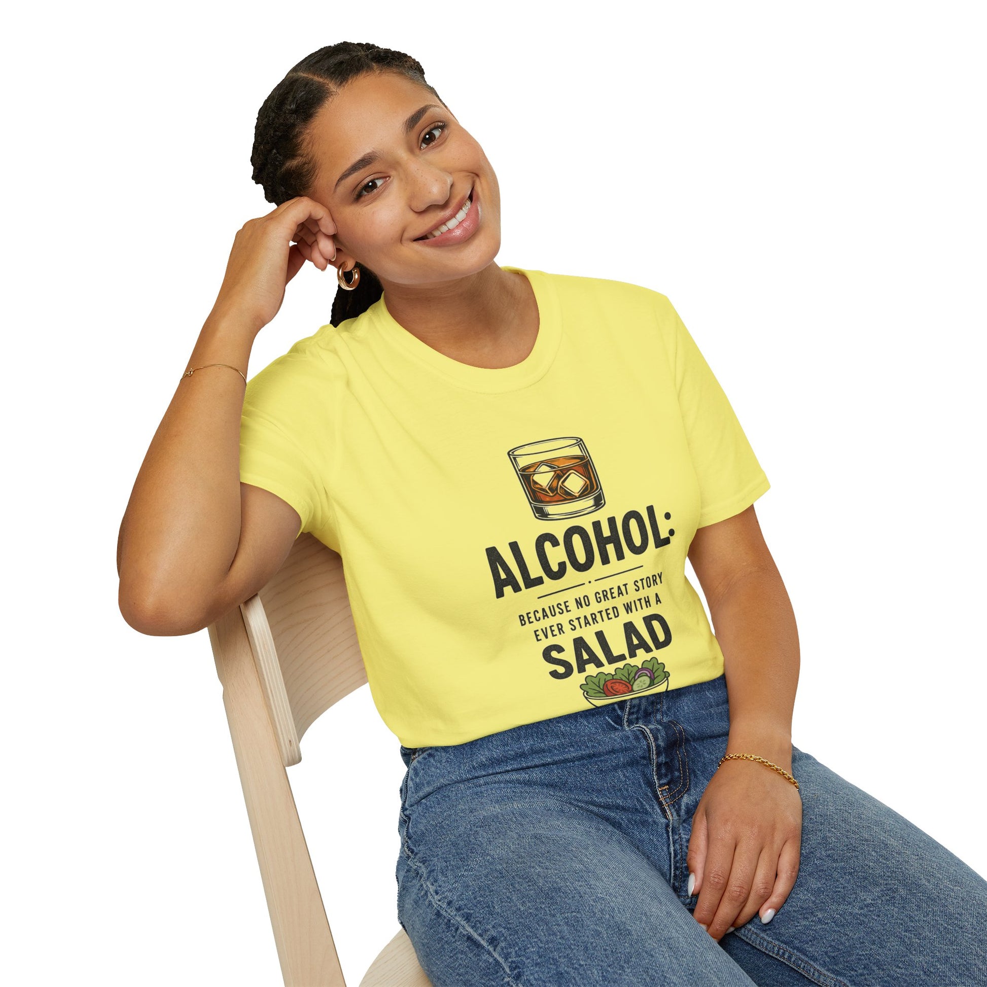 No Great Story Started With a Salad Shirt, Cornsilk pale yellow, worn by a model seated on a wooden chair