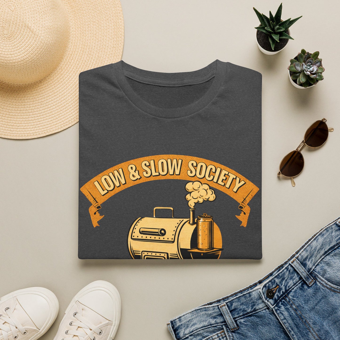 Low & Slow Society Shirt, Dark Heather charcoal, folded flat lay styled with a straw hat, sunglasses, sneakers and denim