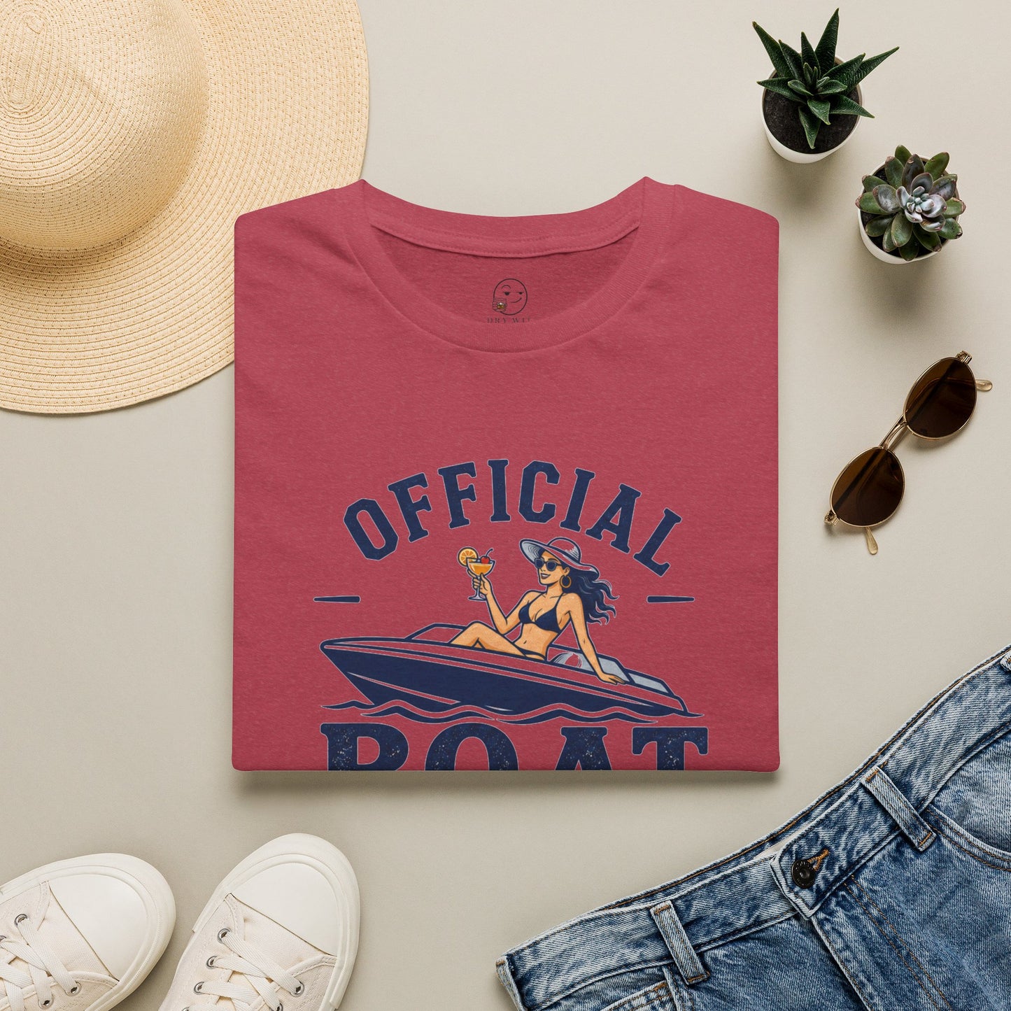 Official Boat Cocktail Drink Tester Shirt, Heather Cardinal red, folded flat lay styled with a straw hat, sunglasses, sneakers and denim