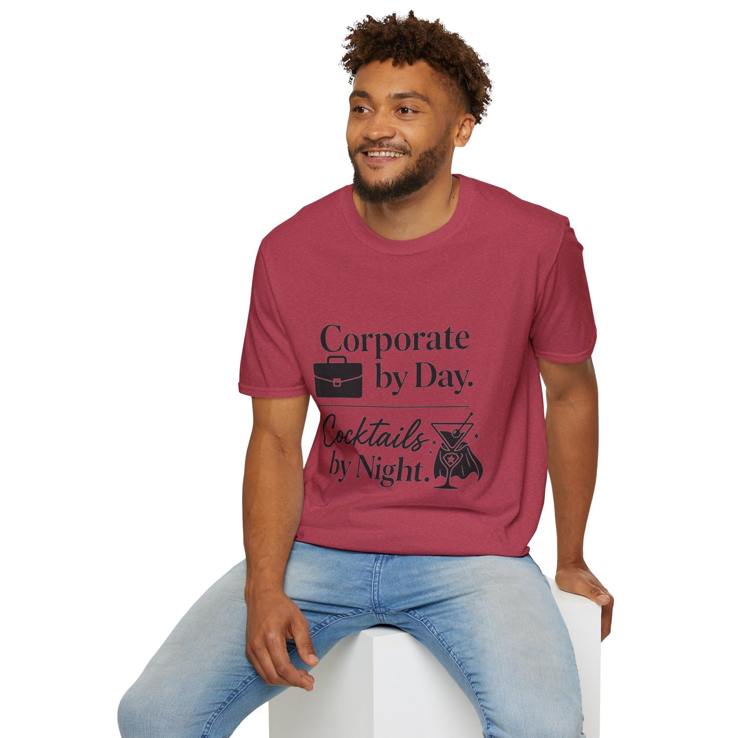 Corporate by Day, Cocktails by Night Shirt, Heather Cardinal red, worn by a model seated on a white block