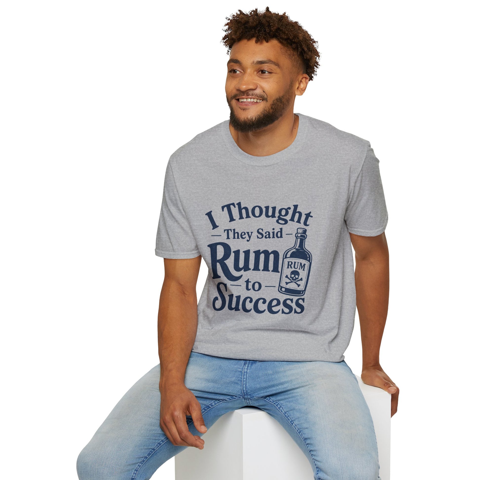 I Thought They Said Rum to Success Shirt, Sport Grey, worn by a model seated on a white block