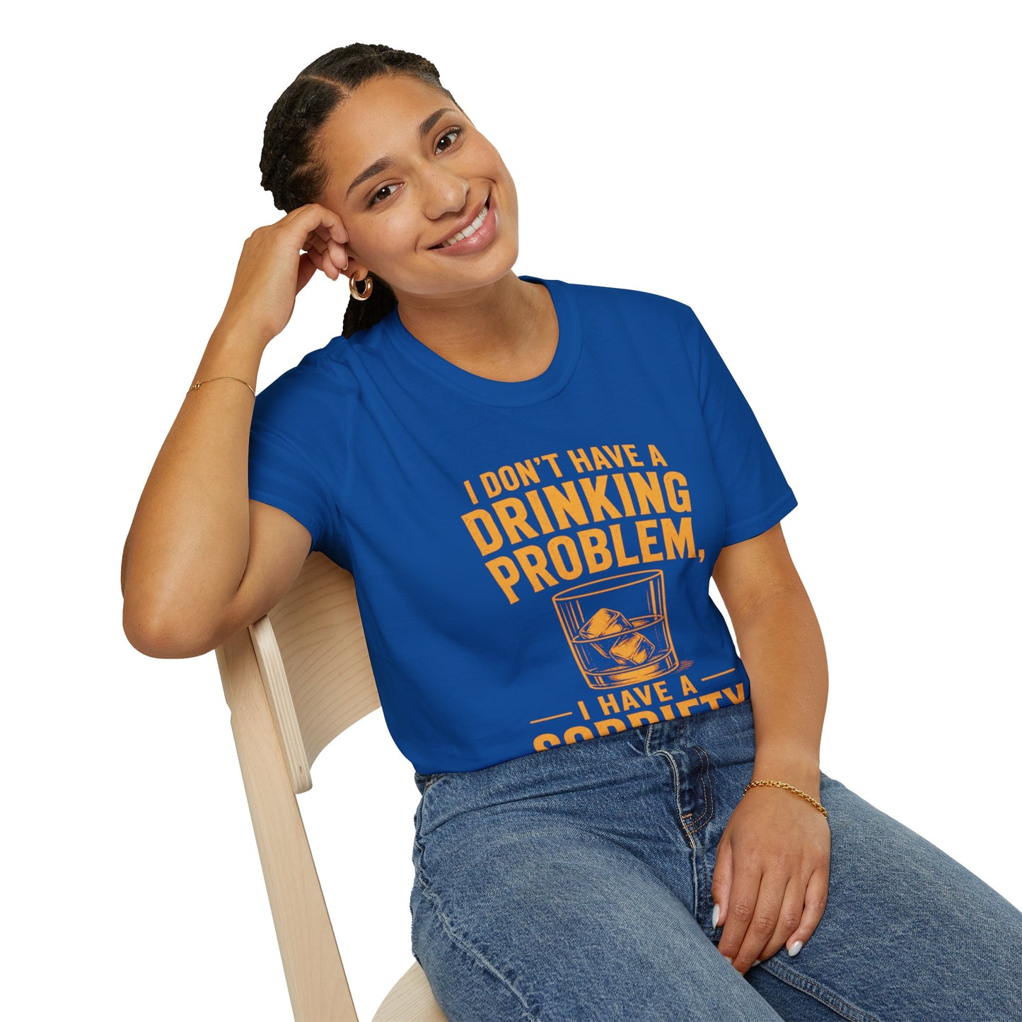 I Don't Have a Drinking Problem Shirt, Royal, worn by a model seated on a wooden chair