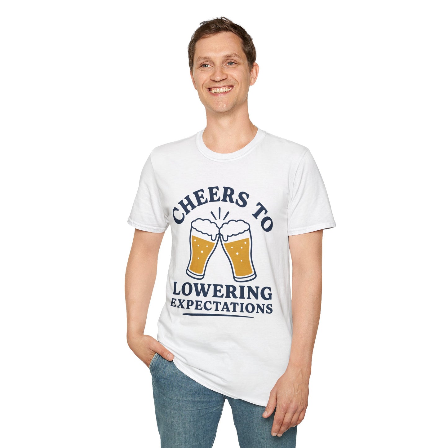 Cheers to Lowering Expectations Shirt, White, worn by a standing model with one hand in their pocket