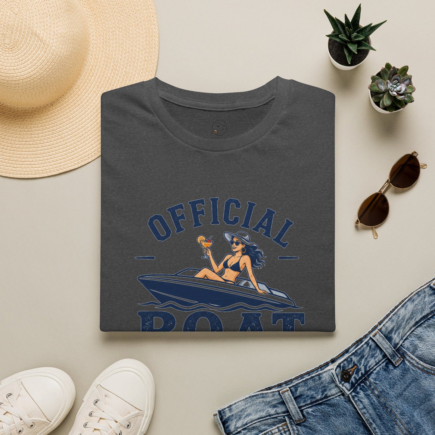 Official Boat Cocktail Drink Tester Shirt, Dark Heather charcoal, folded flat lay styled with a straw hat, sunglasses, sneakers and denim