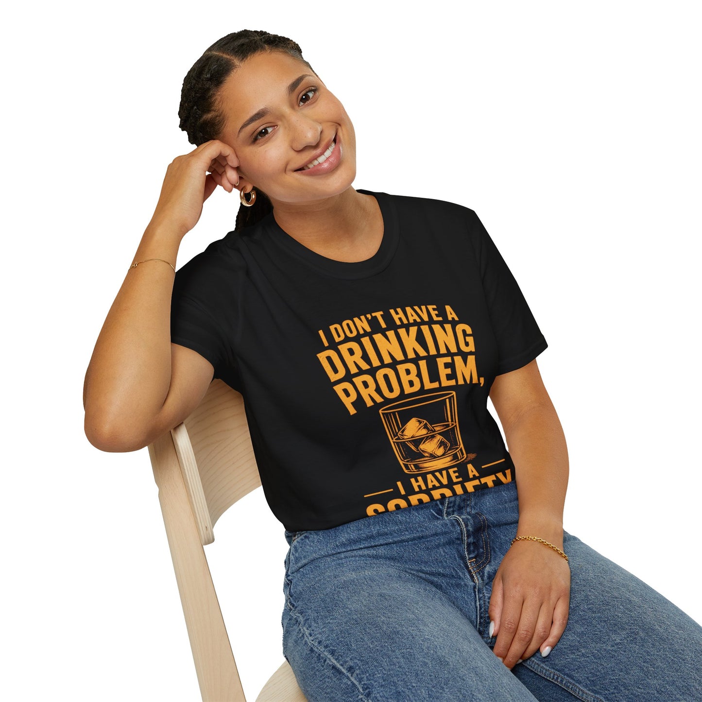 I Don't Have a Drinking Problem Shirt, Black, worn by a model seated on a wooden chair
