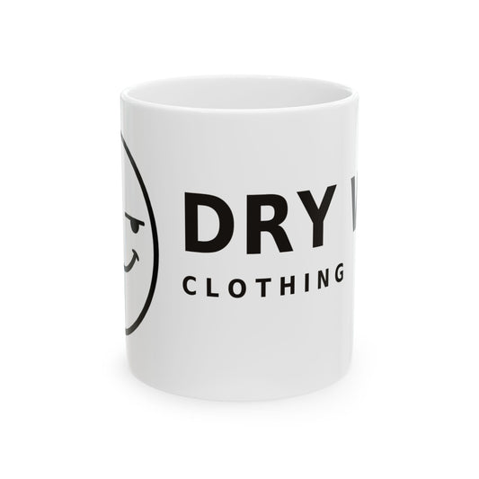 Dry Wit Logo Mug, white ceramic 11 oz, front view with the handle turned out of sight showing the winking emoji logo and DRY WIT CLOTHING wordmark