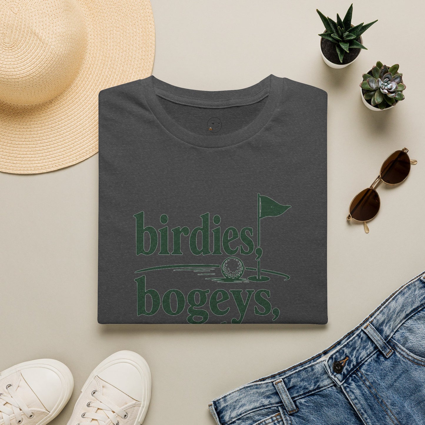 Birdies, Bogeys, and Bourbon Shirt, Dark Heather charcoal, folded flat lay styled with a straw hat, sunglasses, sneakers and denim
