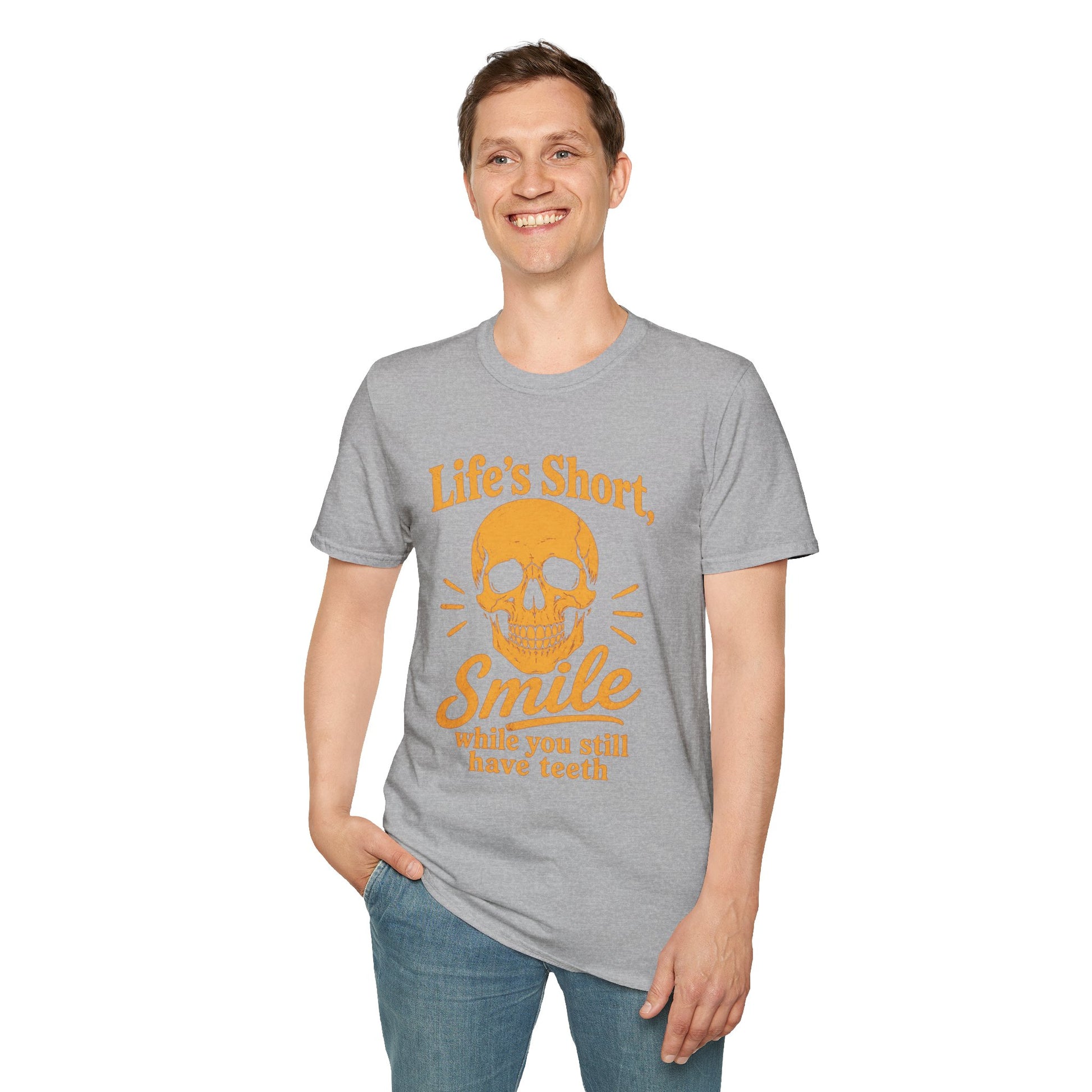 Life's Short, Smile While You Have Teeth Shirt, Sport Grey, worn by a standing model with one hand in their pocket