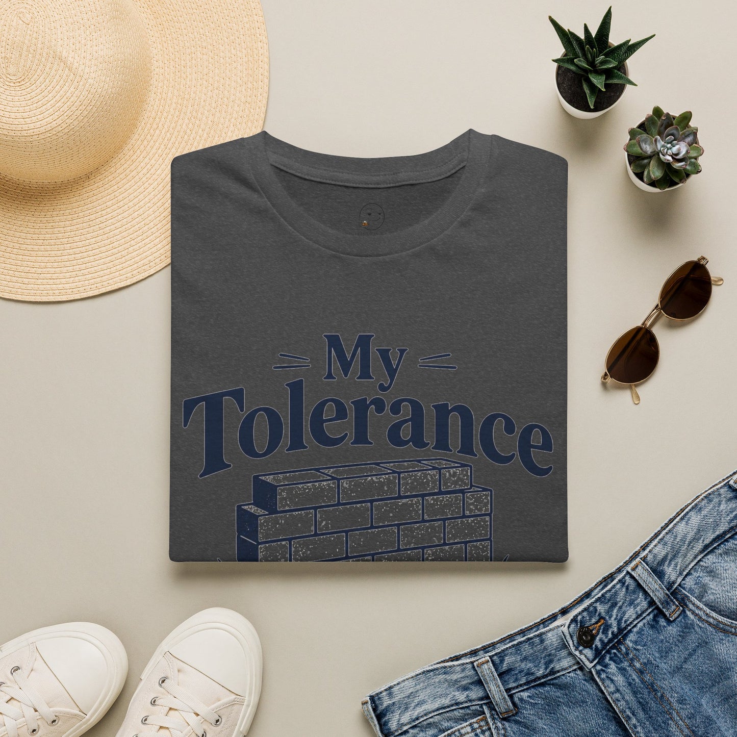 My Tolerance Is the Only Thing I've Built, Dark Heather charcoal, folded flat lay styled with a straw hat, sunglasses, sneakers and denim