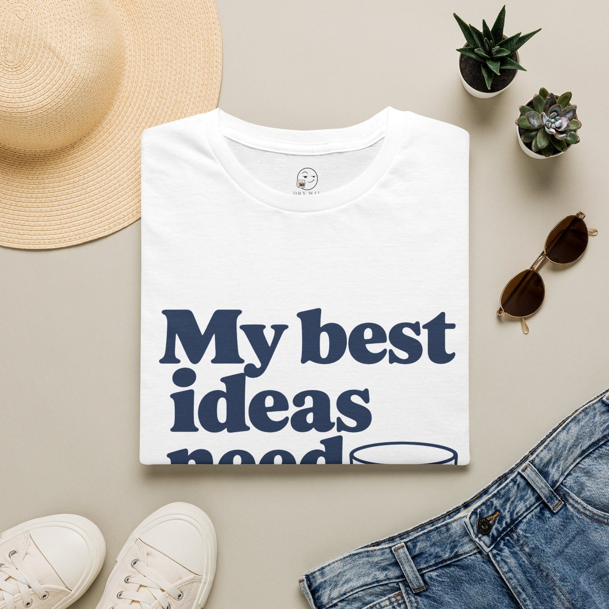 My Best Ideas Need Ice Shirt, White, folded flat lay styled with a straw hat, sunglasses, sneakers and denim