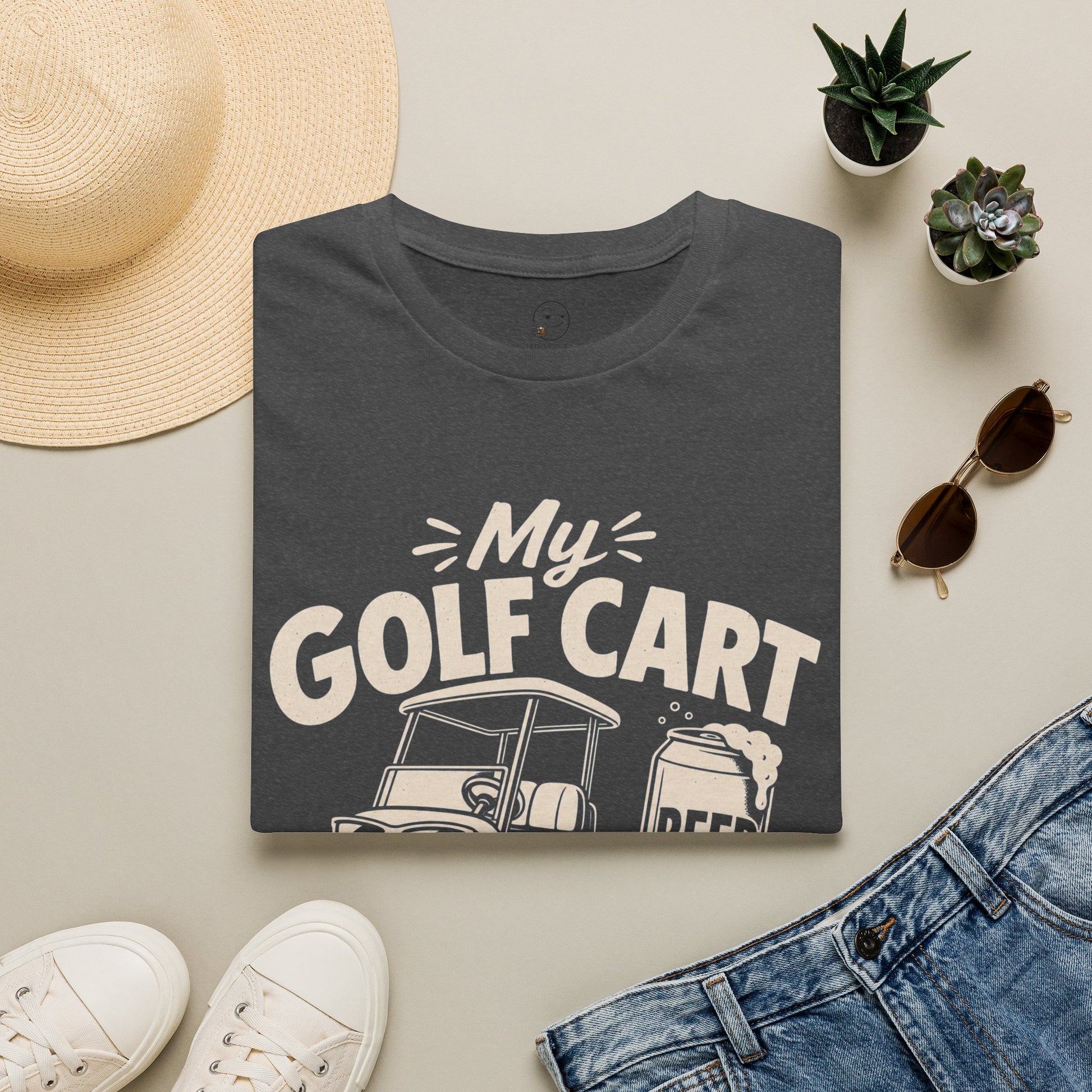 My Golf Cart Runs on Beer Shirt, Metro Blue, folded flat lay styled with a straw hat, sunglasses, sneakers and denim