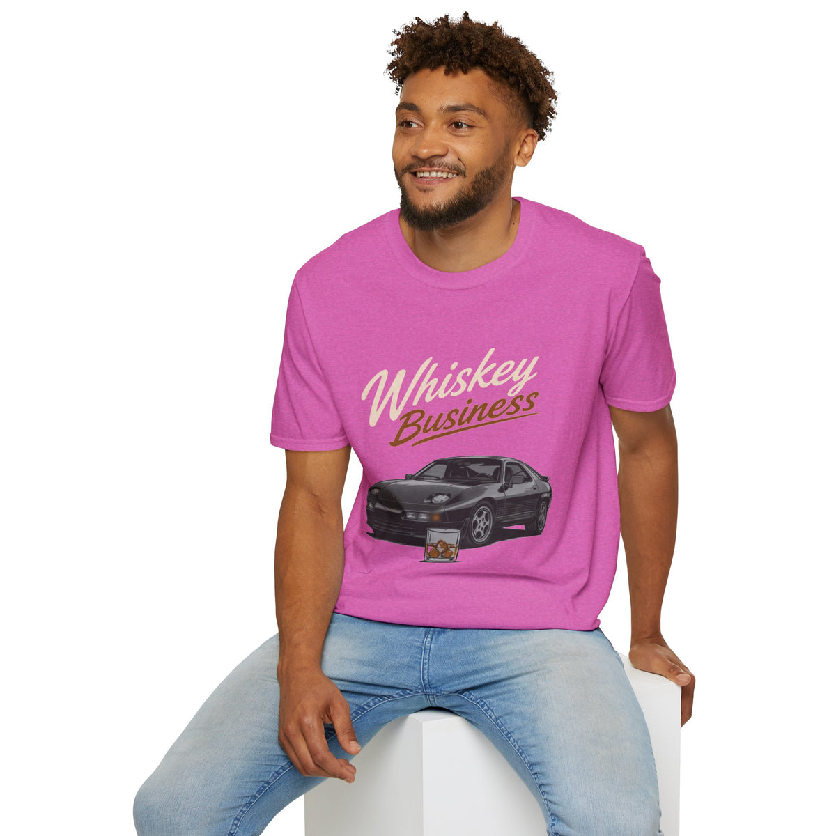 Whiskey Business Shirt, Heather Berry pink, worn by a model seated on a white block