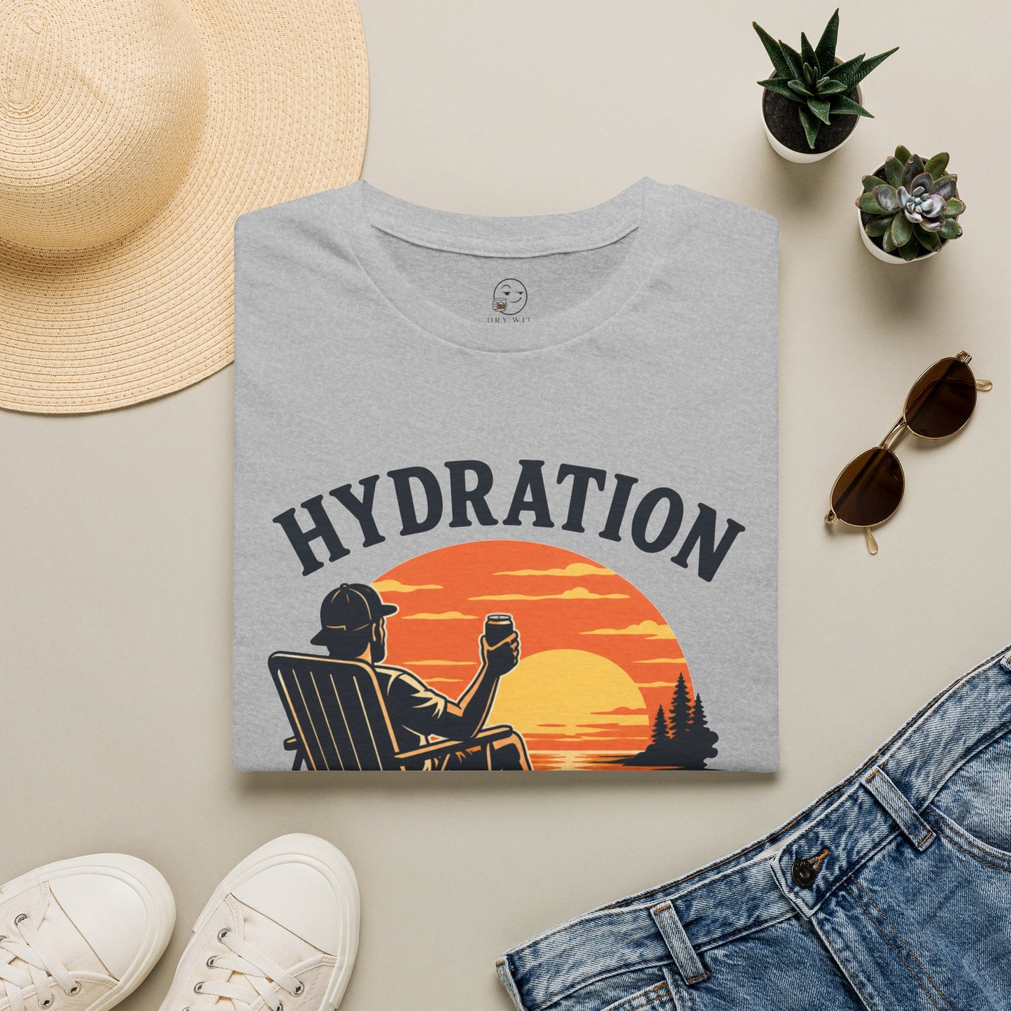 Hydration Is Tomorrow's Problem Shirt, Sport Grey, folded flat lay styled with a straw hat, sunglasses, sneakers and denim