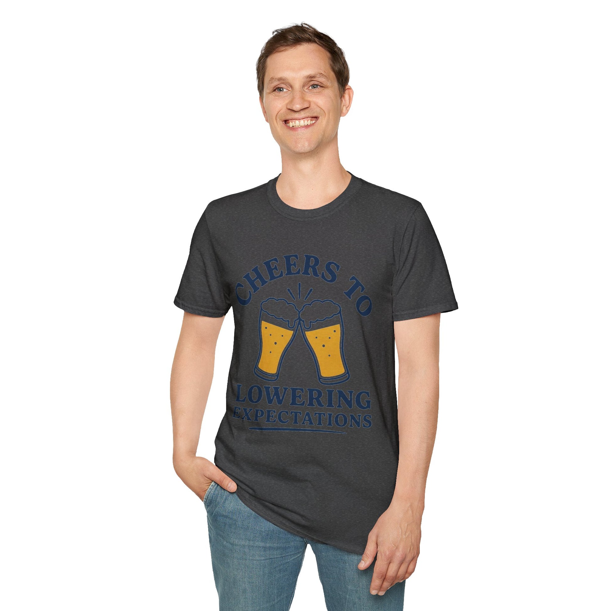 Cheers to Lowering Expectations Shirt, Dark Heather charcoal, worn by a standing model with one hand in their pocket