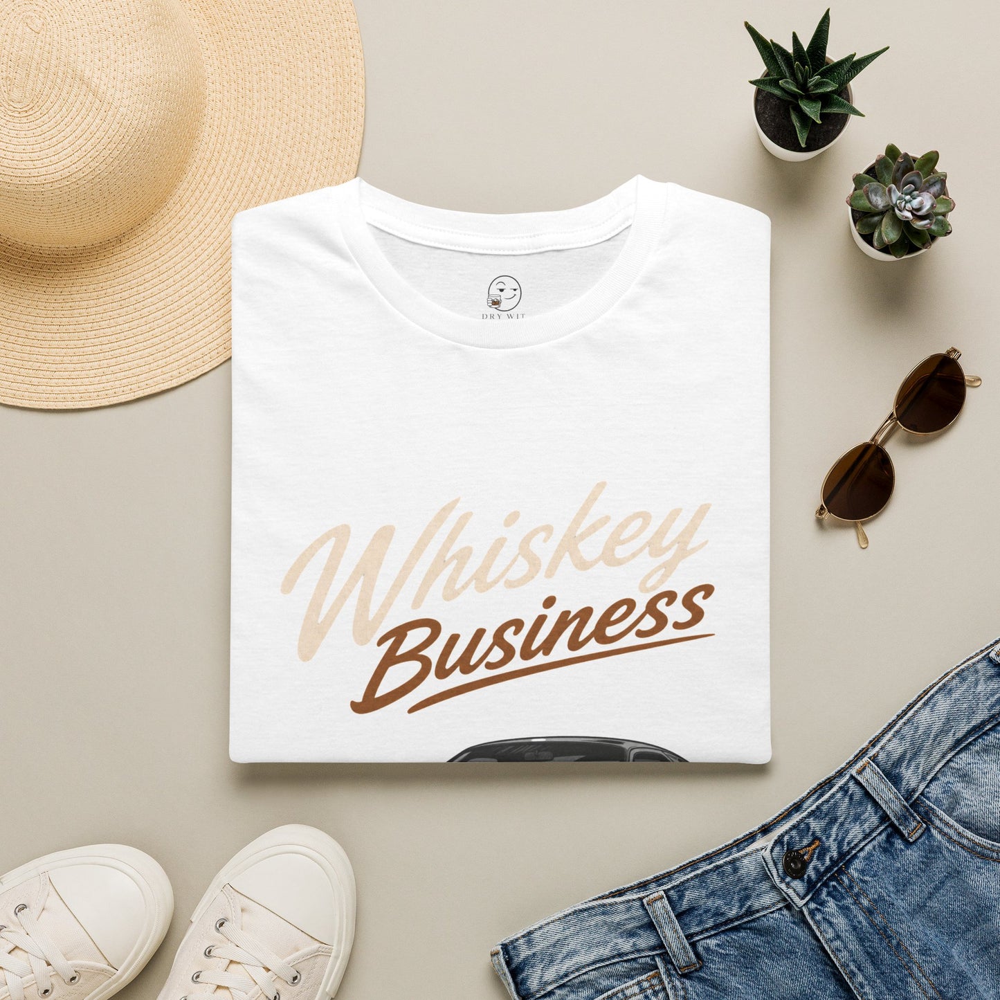 Whiskey Business Shirt, White, folded flat lay styled with a straw hat, sunglasses, sneakers and denim