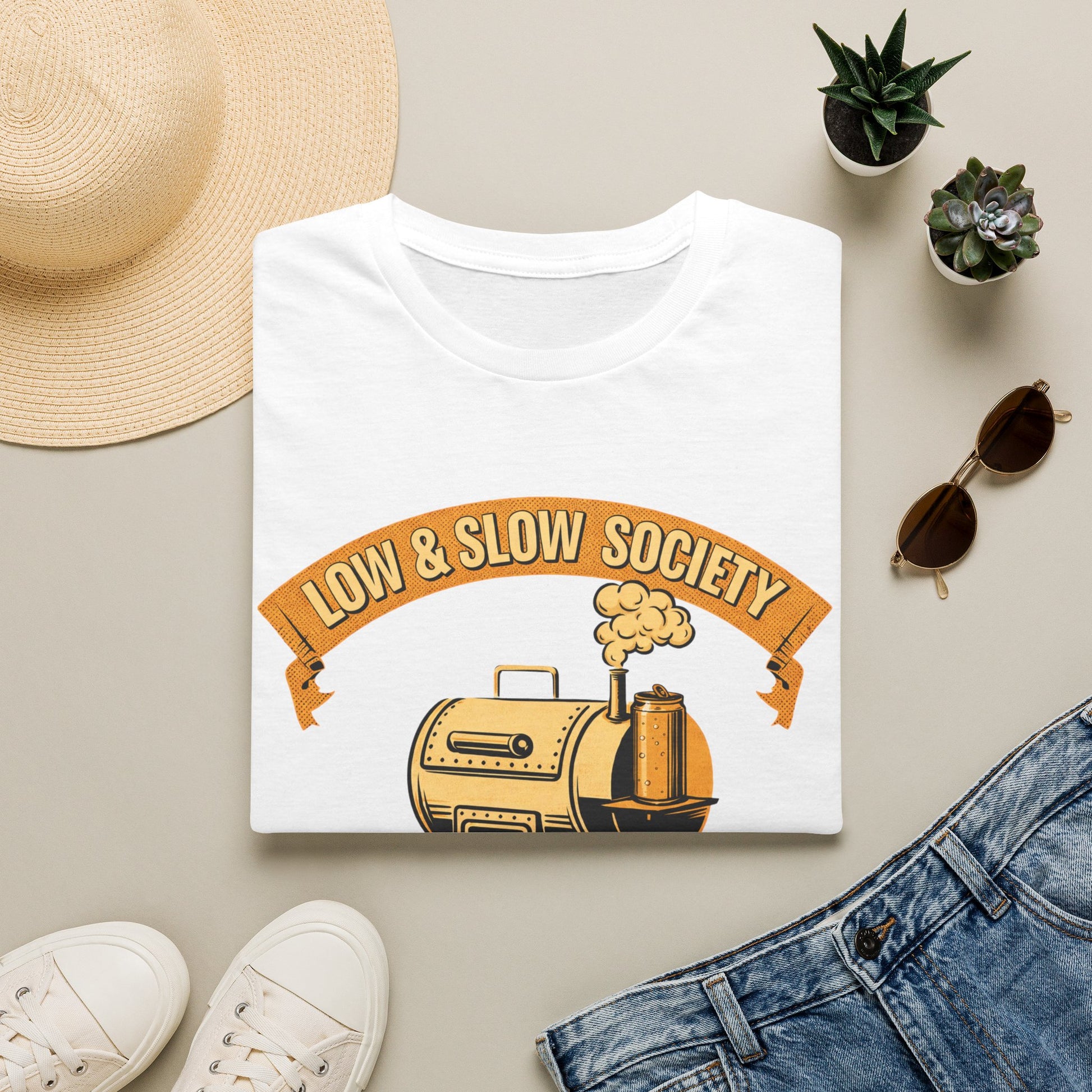 Low & Slow Society Shirt, White, folded flat lay styled with a straw hat, sunglasses, sneakers and denim