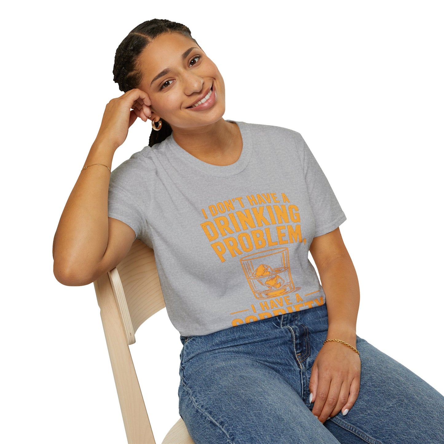 I Don't Have a Drinking Problem Shirt, Sport Grey, worn by a model seated on a wooden chair