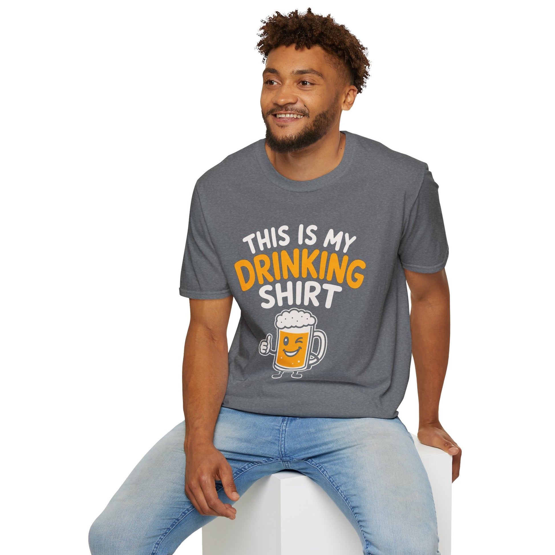 This Is My Drinking Shirt, Graphite Heather grey, worn by a model seated on a white block