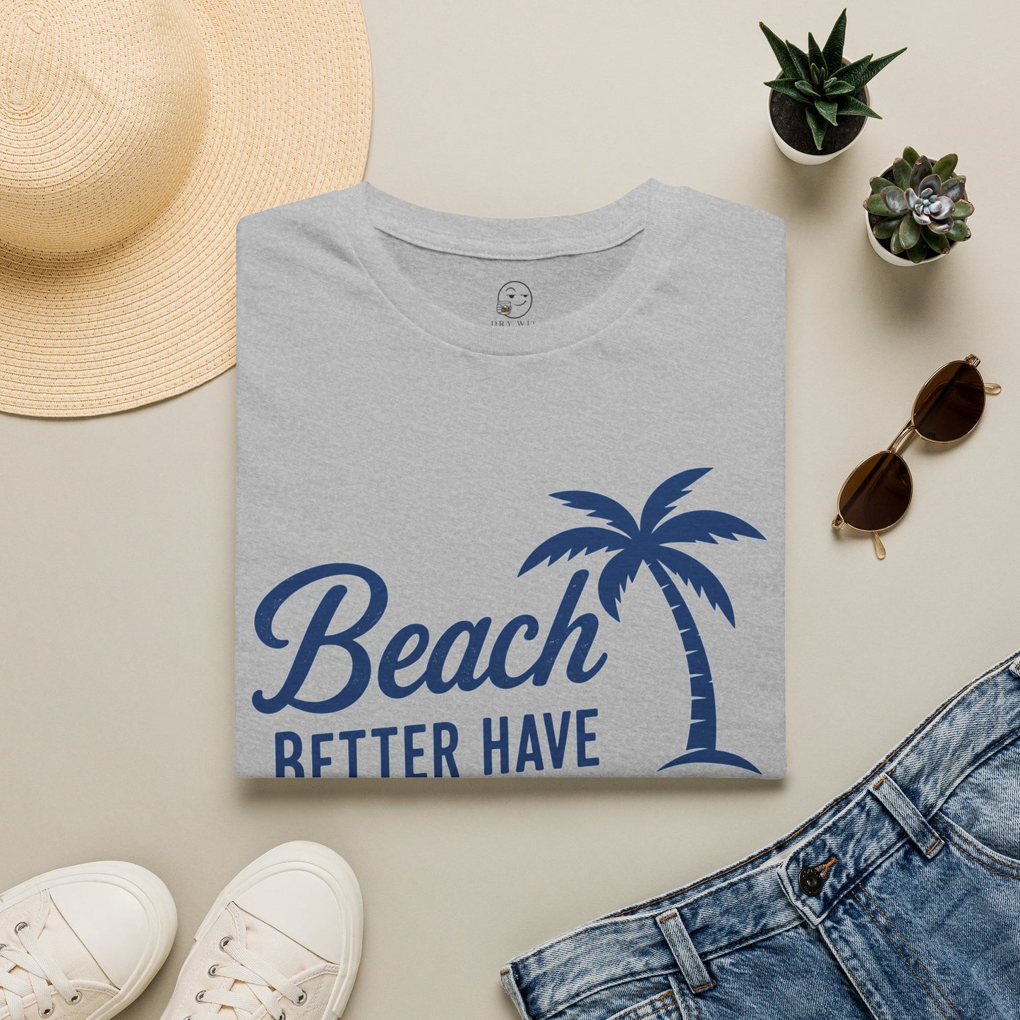 Beach Better Have My Cocktail Shirt, Sport Grey, folded flat lay styled with a straw hat, sunglasses, sneakers and denim