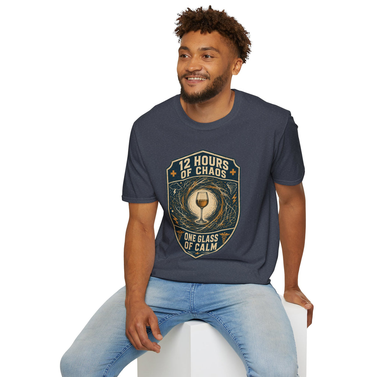 12 Hours of Chaos Shirt, Heather Navy, worn by a model seated on a white block