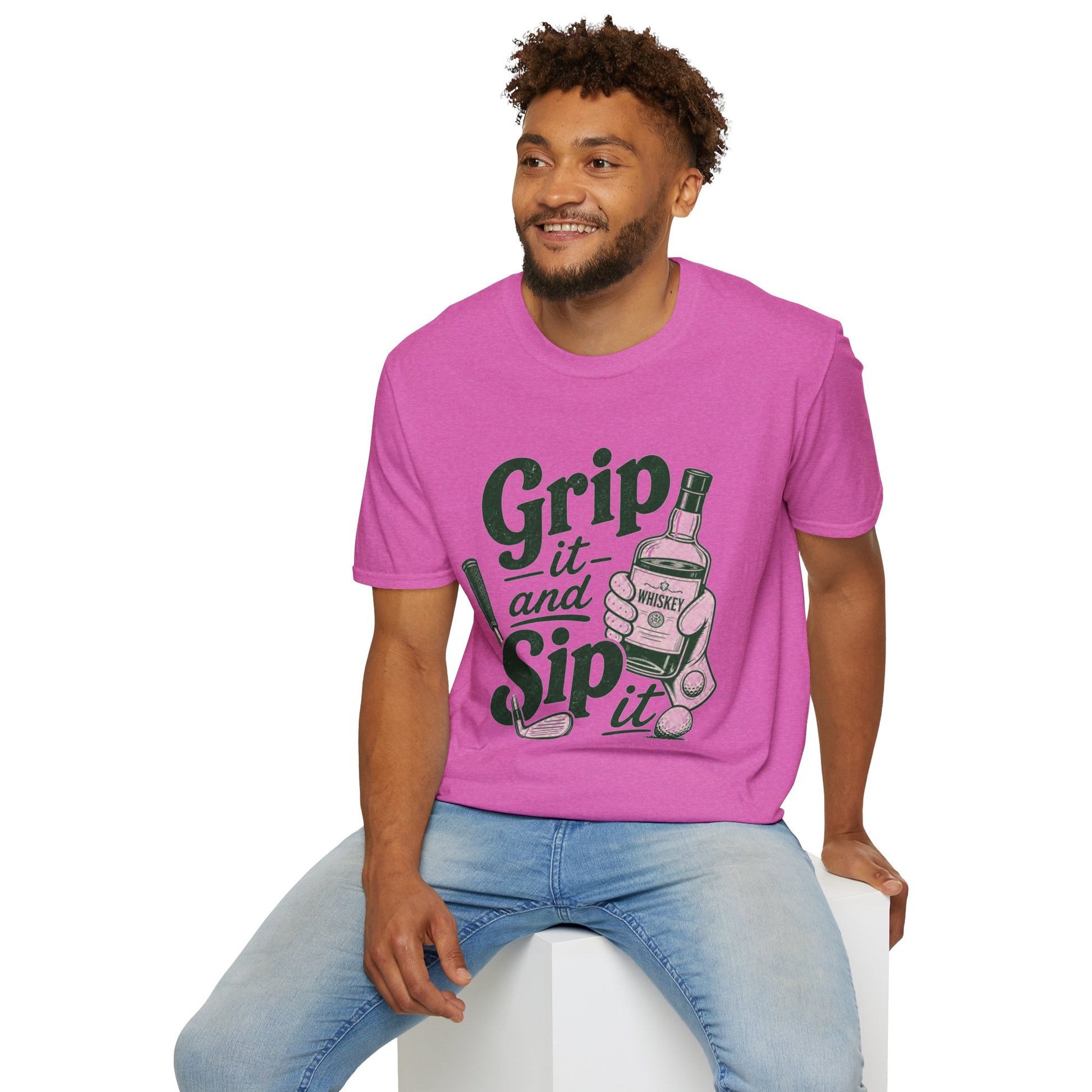 Grip It and Sip It funny golf whiskey shirt, Heather Berry pink, worn by a seated model