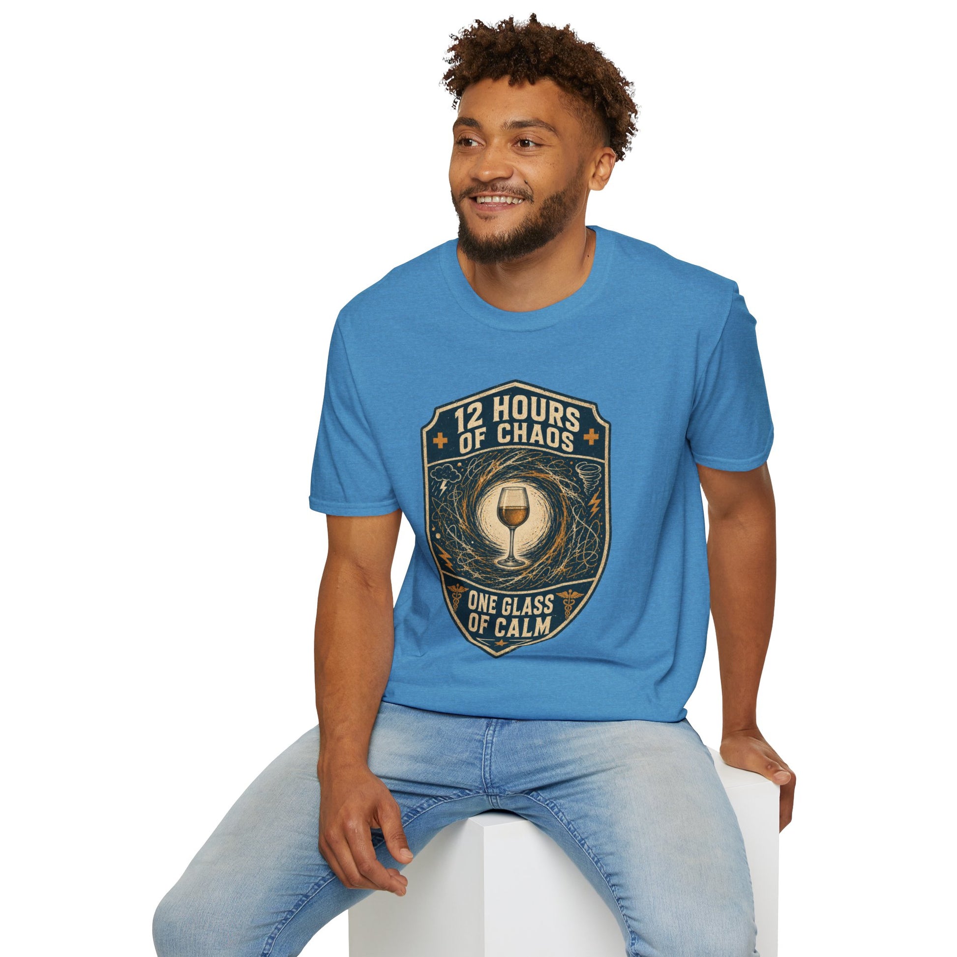 Shield-shaped vintage badge t-shirt graphic of a wine glass sitting calmly amid a swirling chaos symbol, text reading 12 Hours Of Chaos, One Glass Of Calm