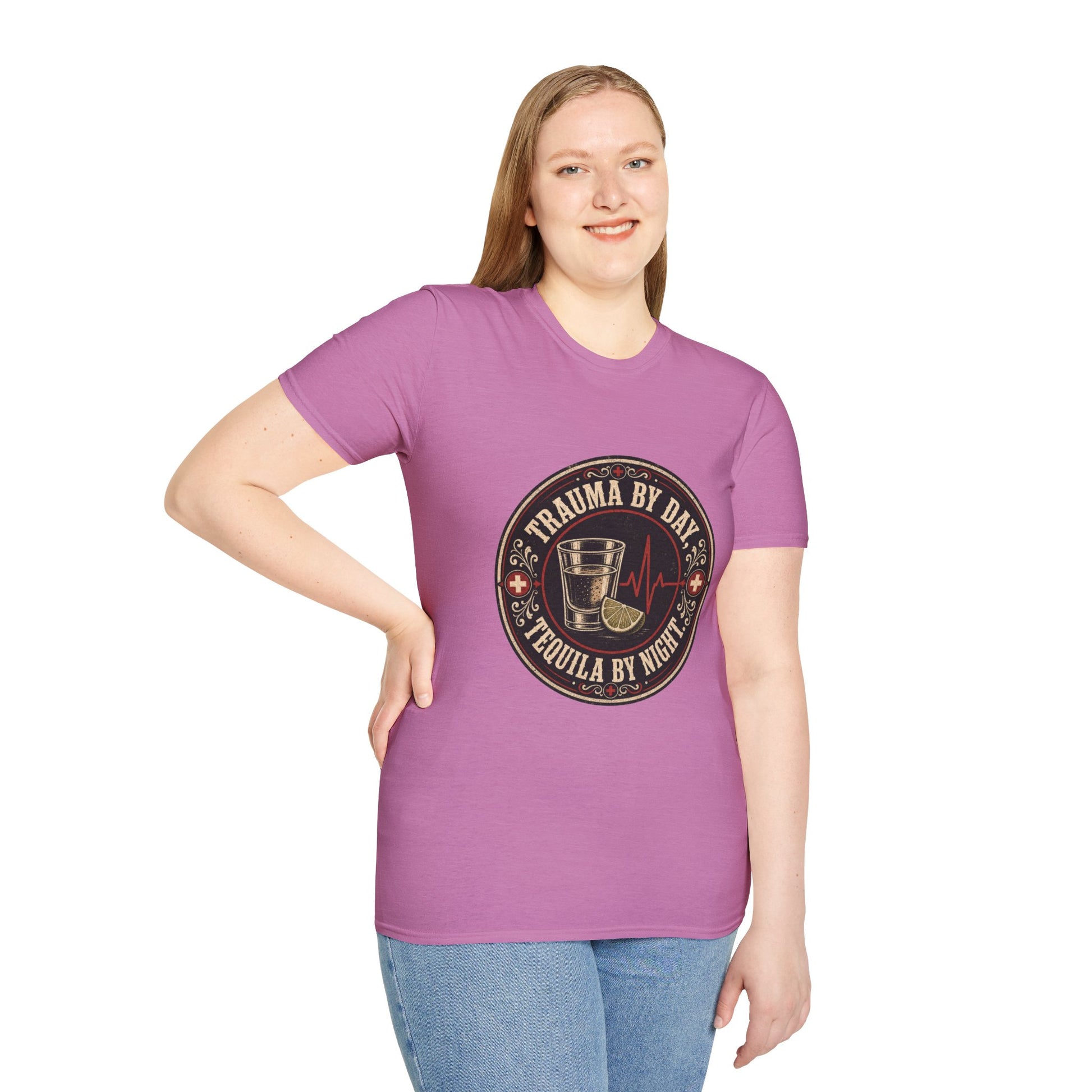 Circular vintage badge t-shirt graphic with a red cross border detail, a shot glass and lime wedge beside a heartbeat line, text reading Trauma By Day, Tequila By Night