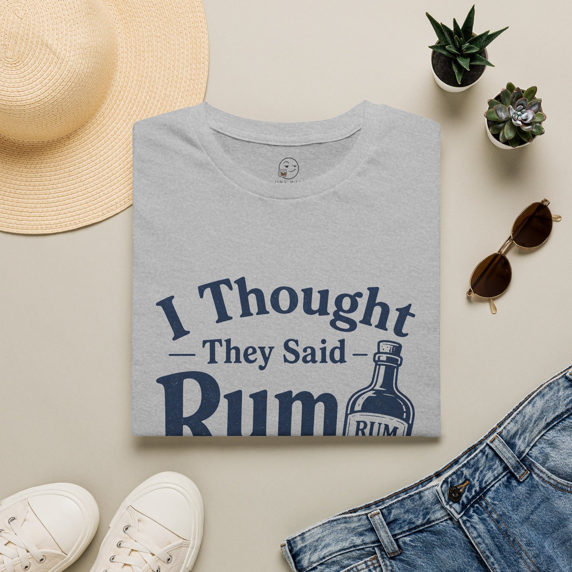 I Thought They Said Rum to Success Shirt, Sport Grey, folded flat lay styled with a straw hat, sunglasses, sneakers and denim