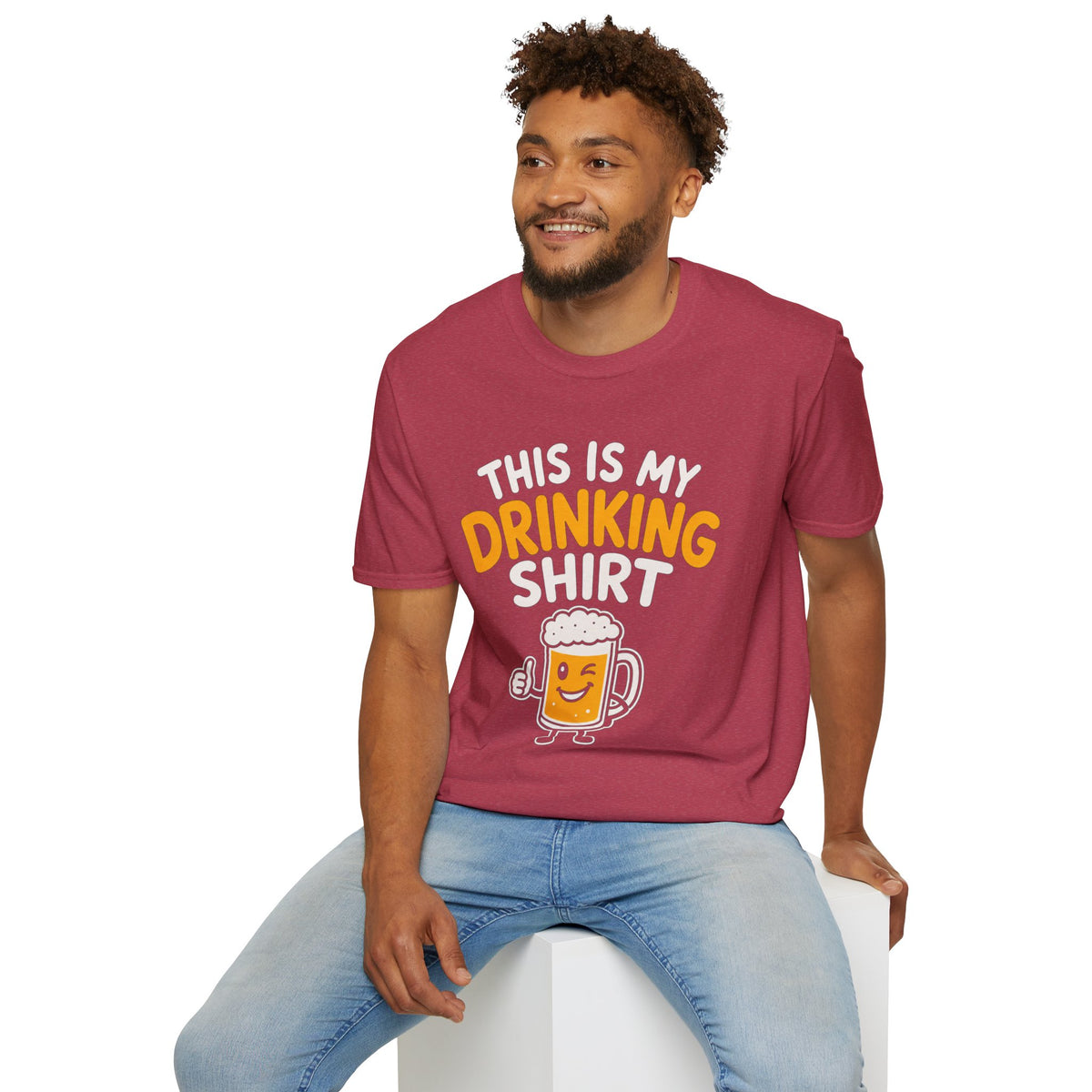 This Is My Drinking Shirt, Heather Cardinal red, worn by a model seated on a white block