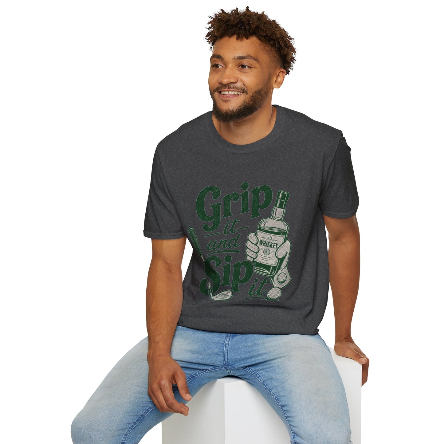 Grip It and Sip It funny golf whiskey shirt, Dark Heather charcoal, worn by a seated model