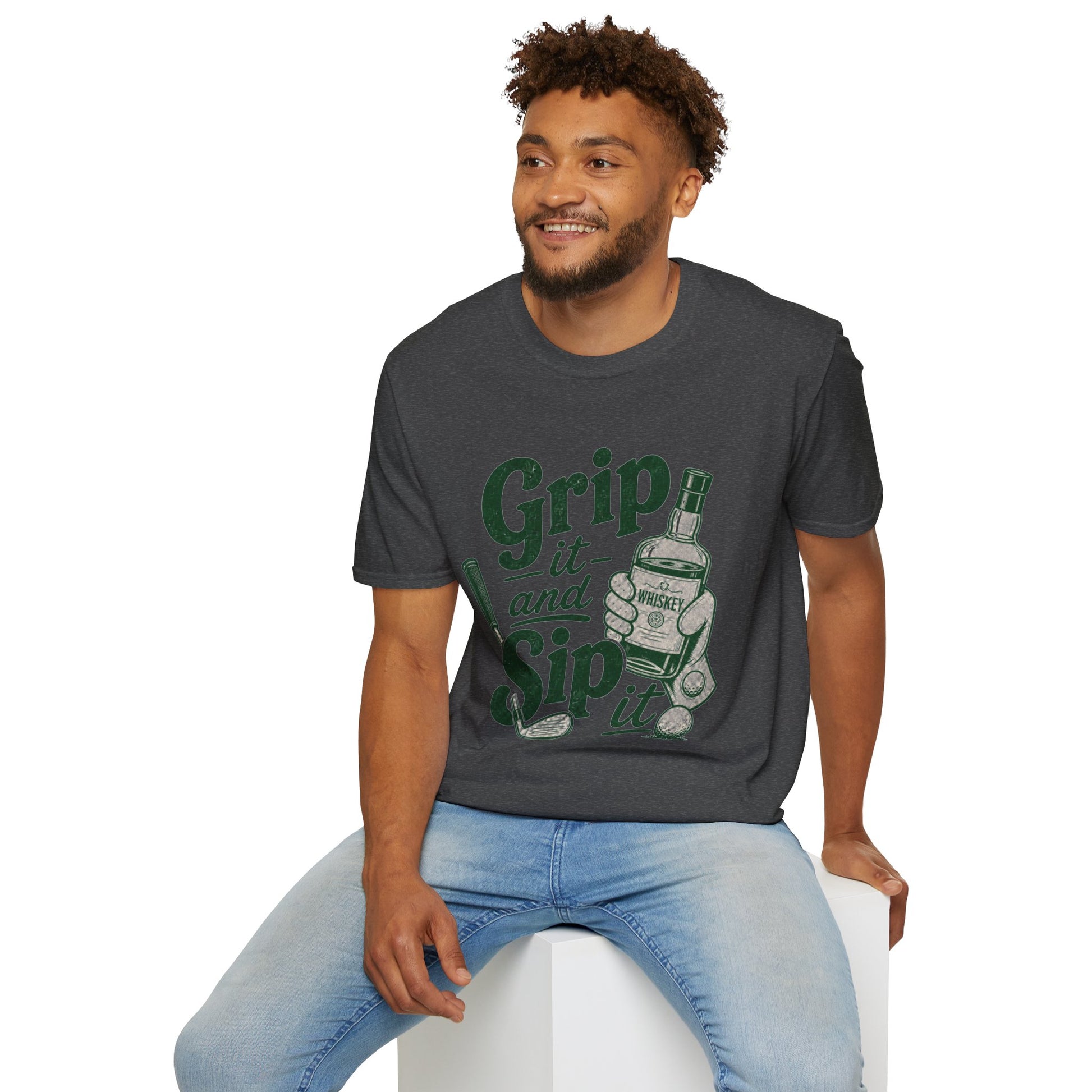 Grip It and Sip It funny golf whiskey shirt, Dark Heather charcoal, worn by a seated model