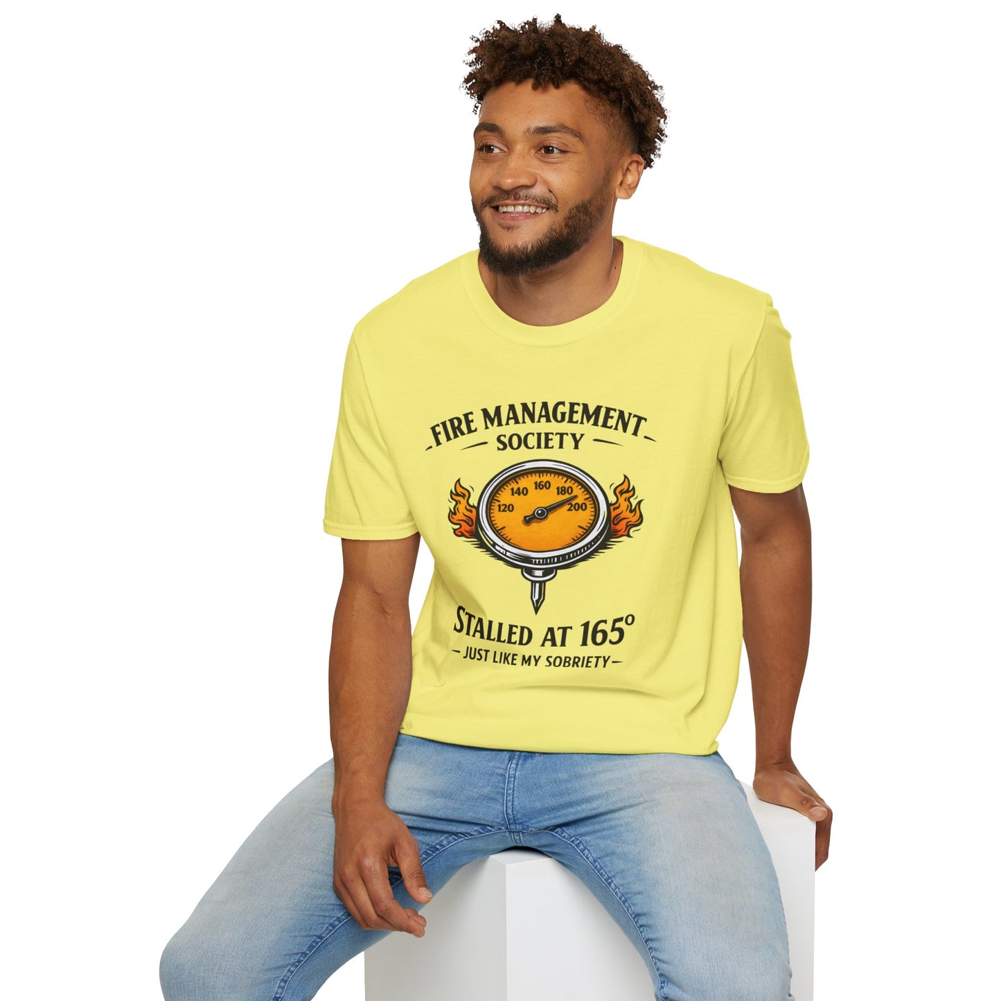 Fire Management Society Shirt, Cornsilk pale yellow, worn by a model seated on a white block