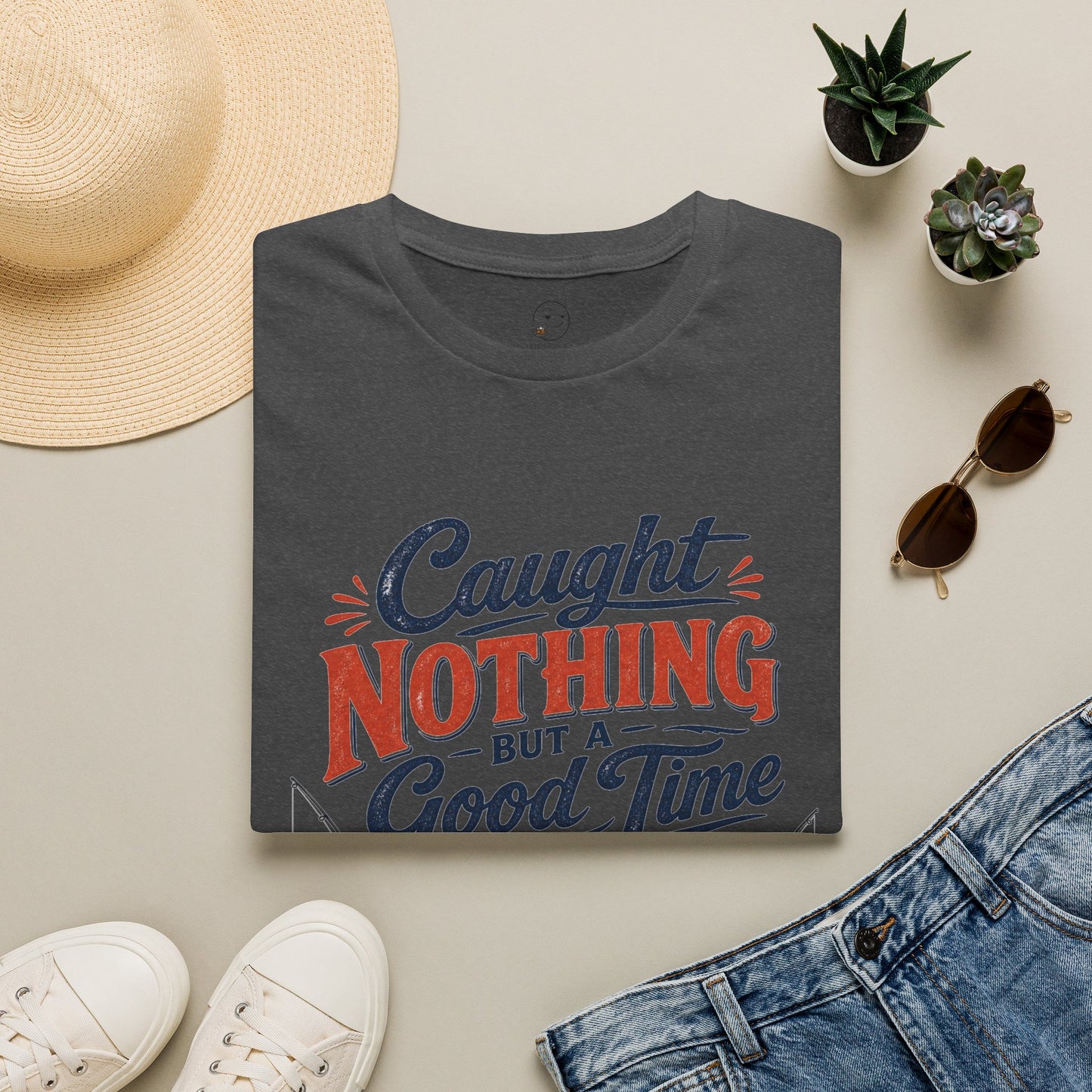 Caught Nothing But a Good Time Shirt, Dark Heather charcoal, folded flat lay styled with a straw hat, sunglasses, sneakers and denim