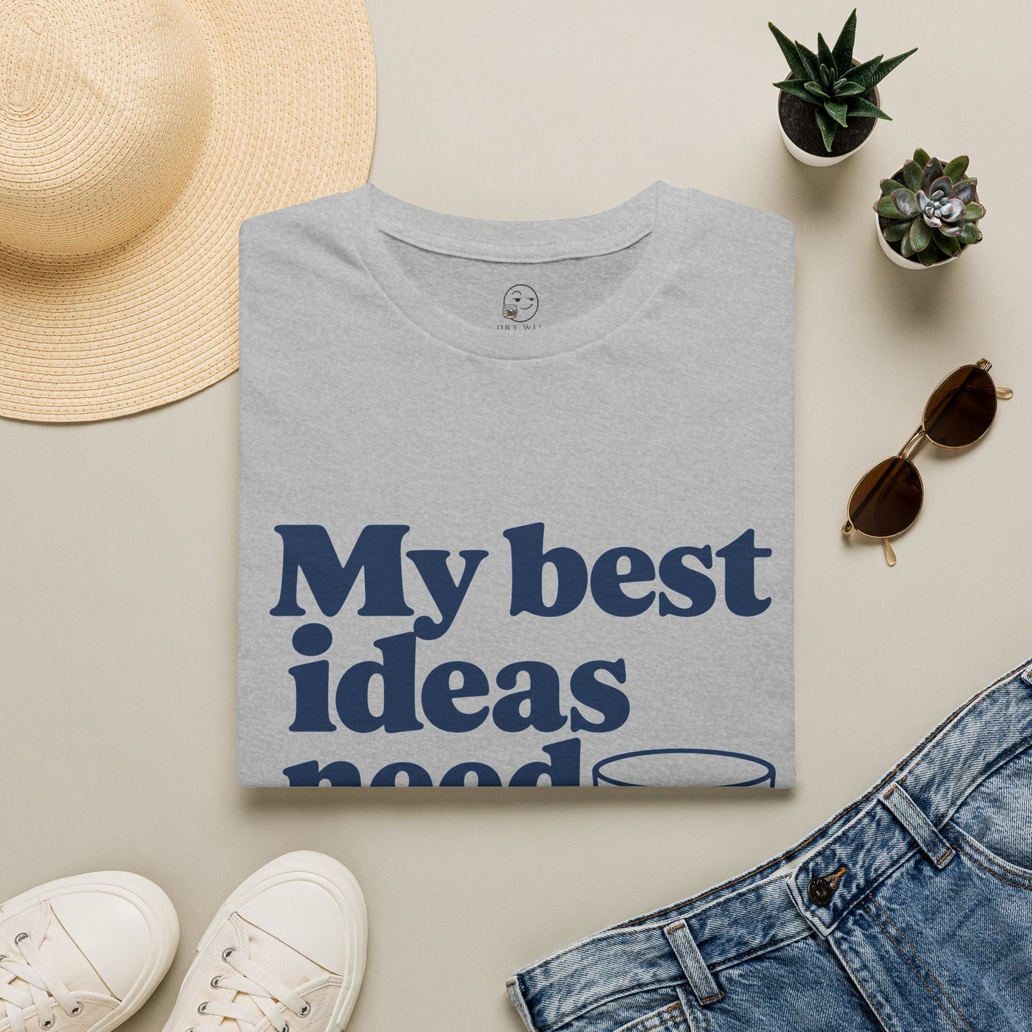 My Best Ideas Need Ice Shirt, Sport Grey, folded flat lay styled with a straw hat, sunglasses, sneakers and denim