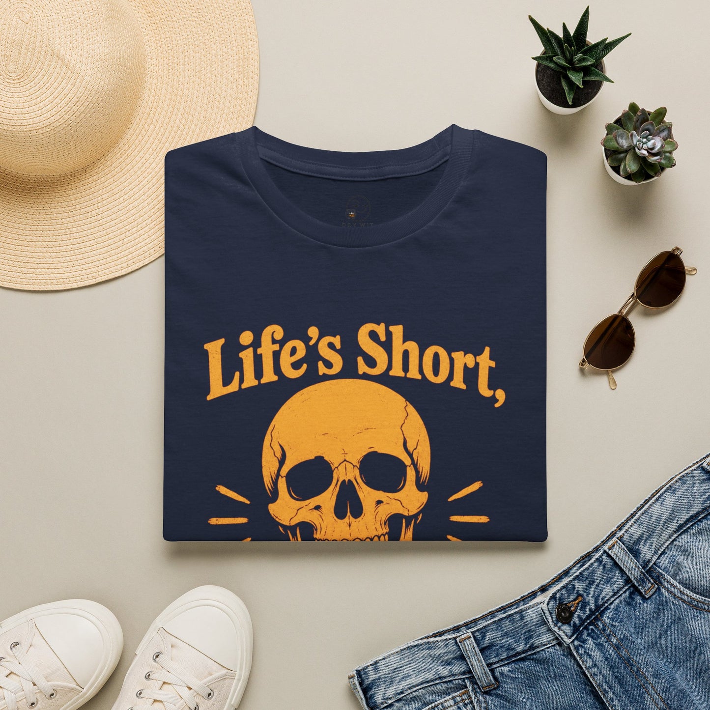 Life's Short, Smile While You Have Teeth Shirt, Navy, folded flat lay styled with a straw hat, sunglasses, sneakers and denim