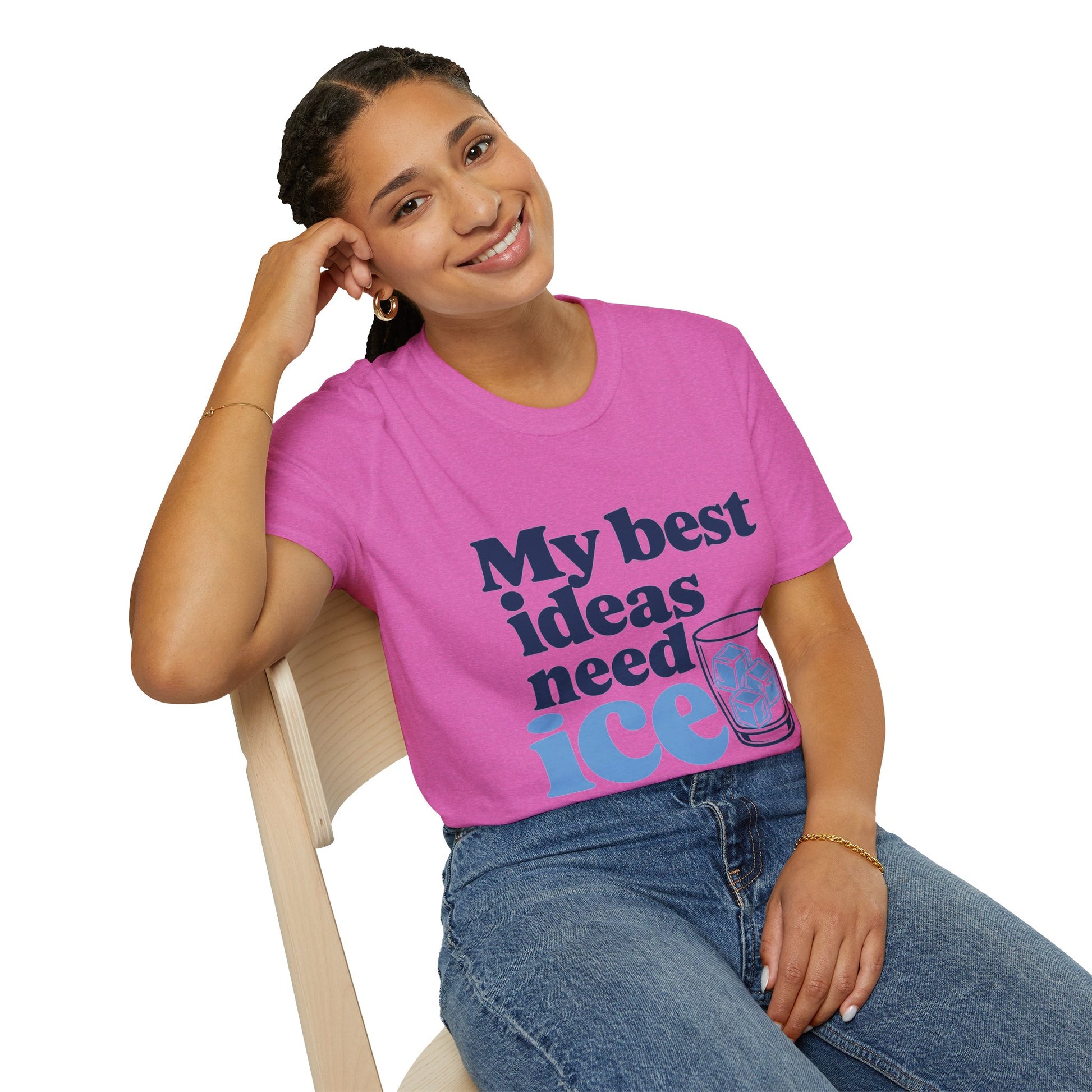 My Best Ideas Need Ice Shirt, Heather Berry pink, worn by a model seated on a wooden chair