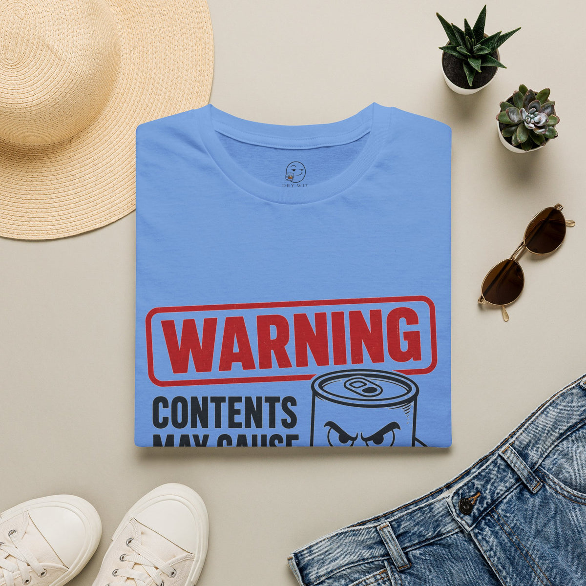 Warning: Contents May Cause Brutal Honesty Shirt, Carolina Blue, folded flat lay styled with a straw hat, sunglasses, sneakers and denim
