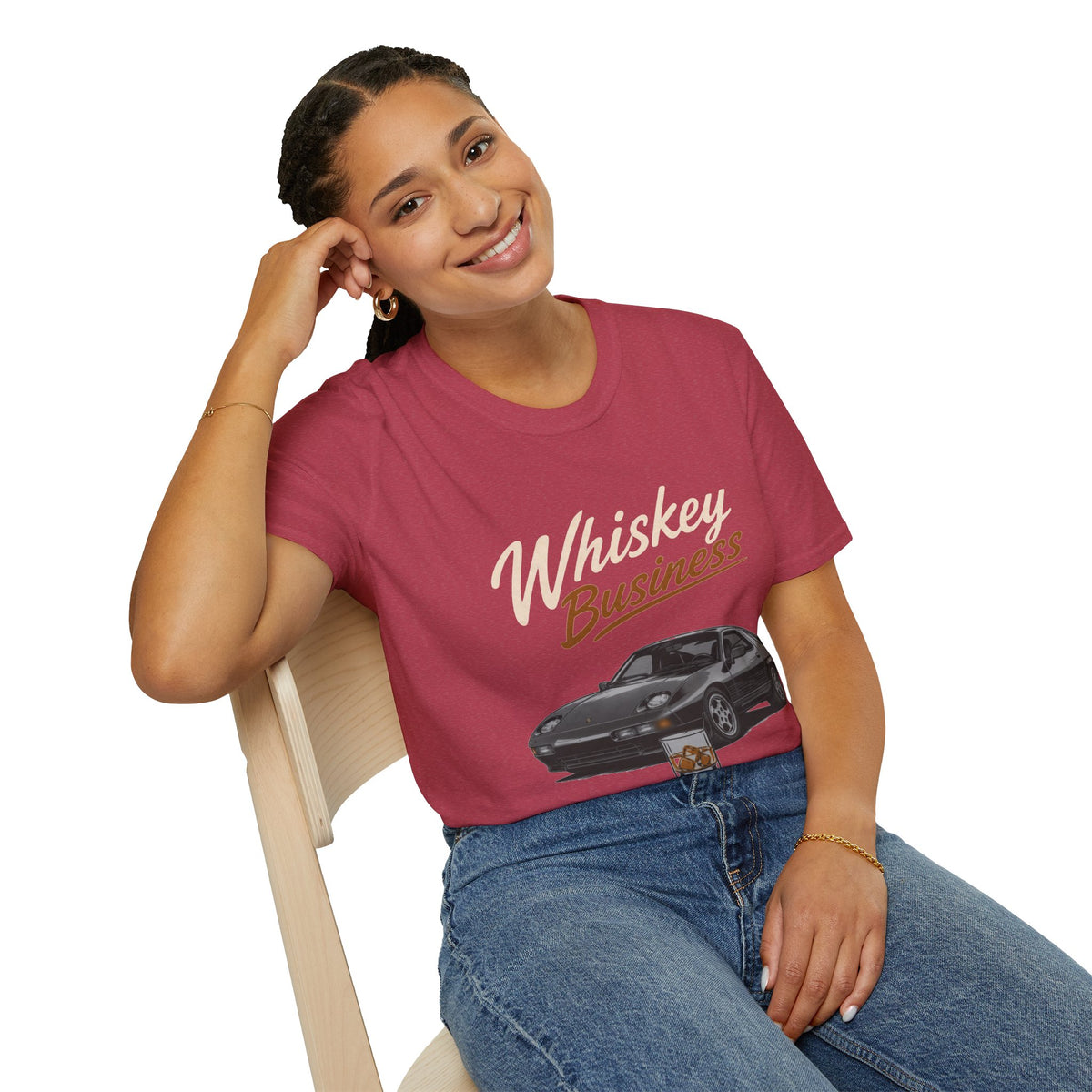 Whiskey Business Shirt, Heather Cardinal red, worn by a model seated on a wooden chair