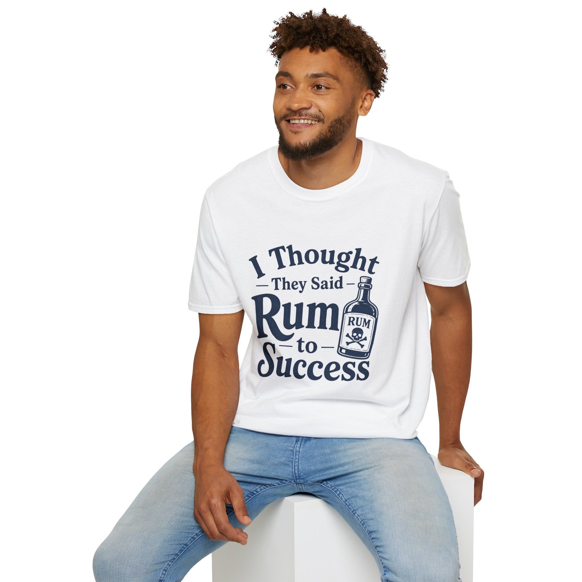 I Thought They Said Rum to Success Shirt, White, worn by a model seated on a white block