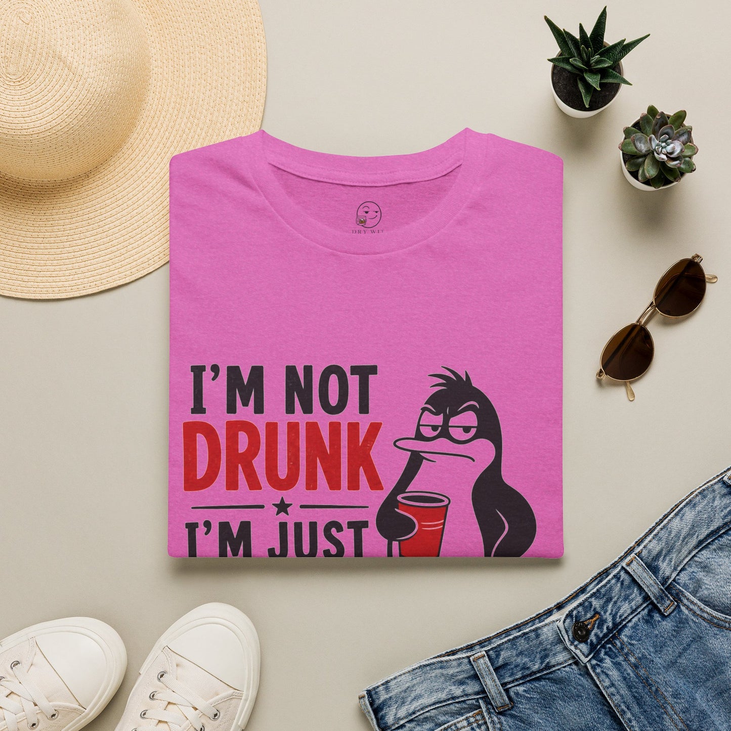 I'm Not Drunk, I'm Just Fluent in Sarcasm Shirt, Heather Berry pink, folded flat lay styled with a straw hat, sunglasses, sneakers and denim