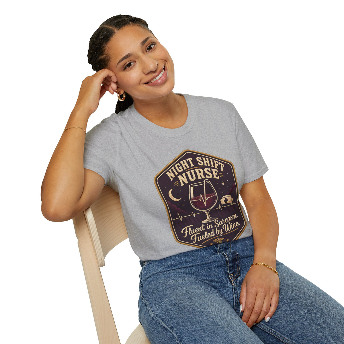 Fluent in Sarcasm Shirt, Sport Grey, worn by a model seated on a wooden chair