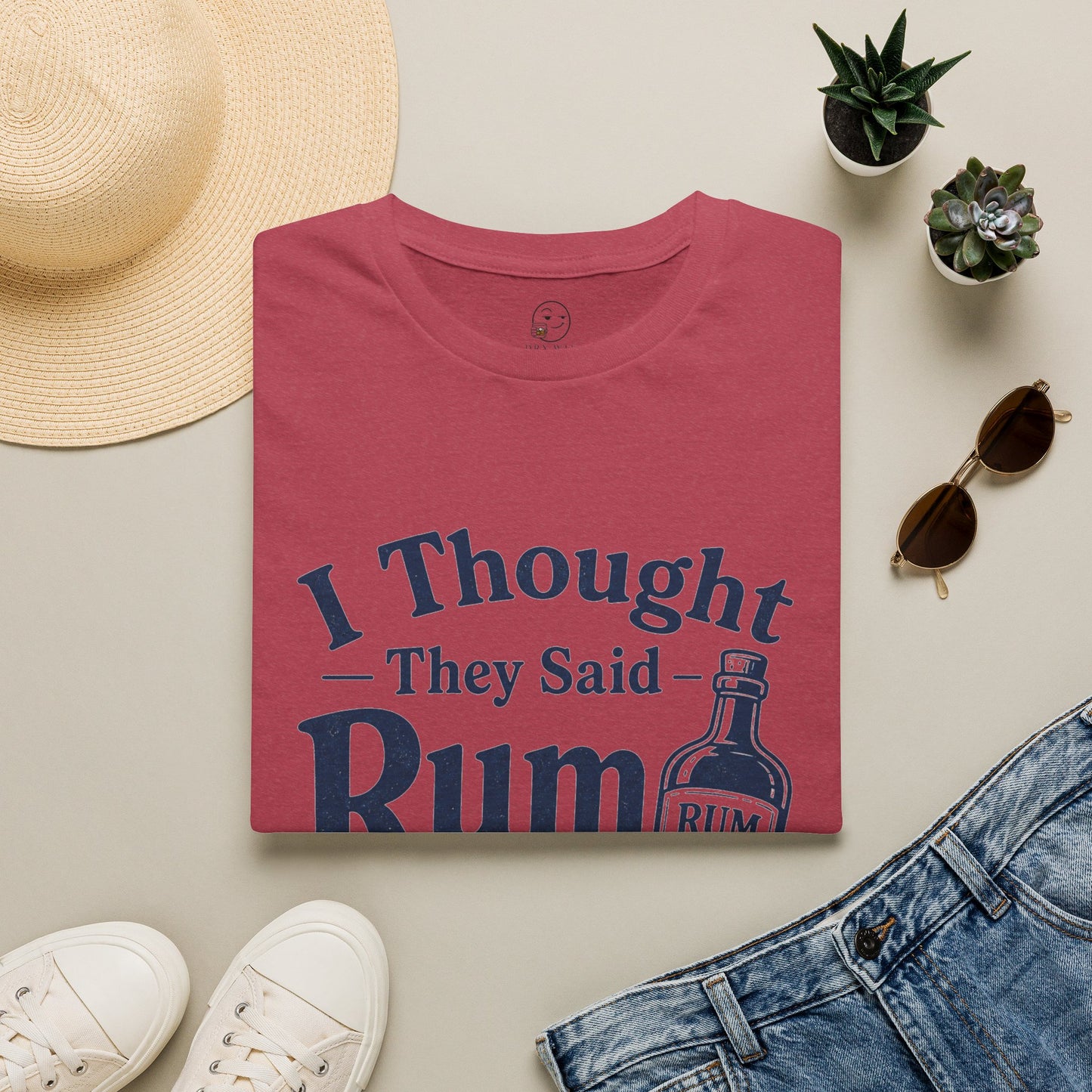 I Thought They Said Rum to Success Shirt, Heather Cardinal red, folded flat lay styled with a straw hat, sunglasses, sneakers and denim