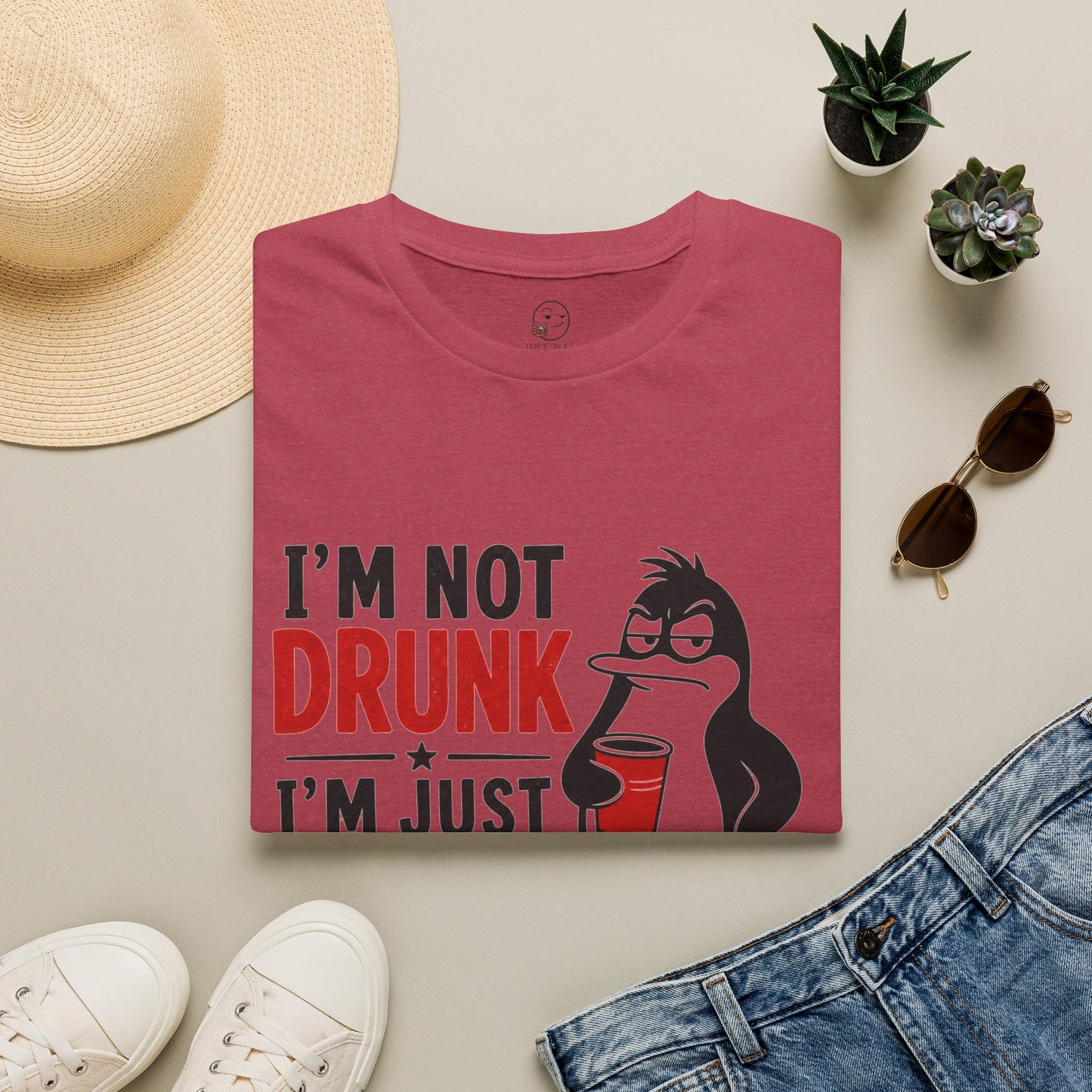 I'm Not Drunk, I'm Just Fluent in Sarcasm Shirt, Heather Cardinal red, folded flat lay styled with a straw hat, sunglasses, sneakers and denim