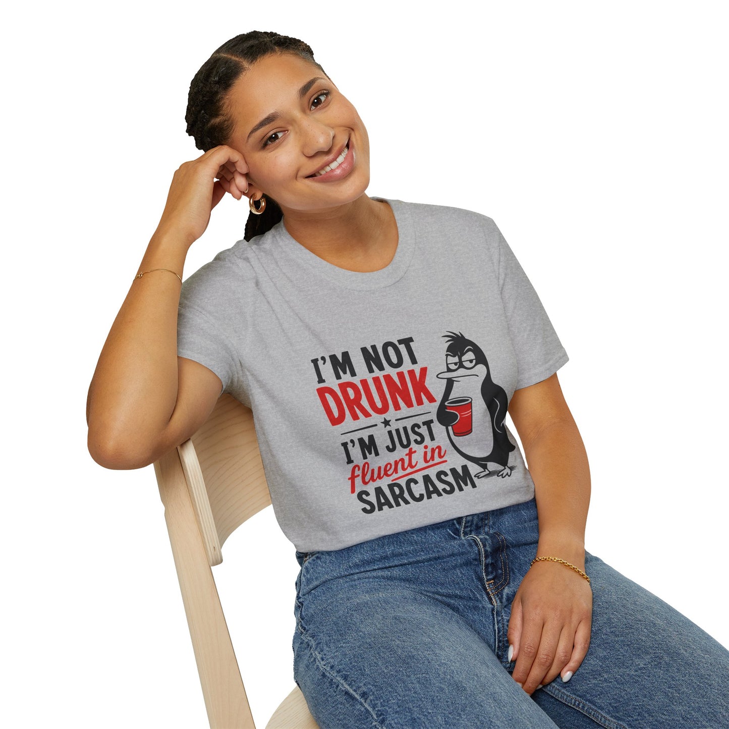 I'm Not Drunk, I'm Just Fluent in Sarcasm Shirt, Sport Grey, worn by a model seated on a wooden chair