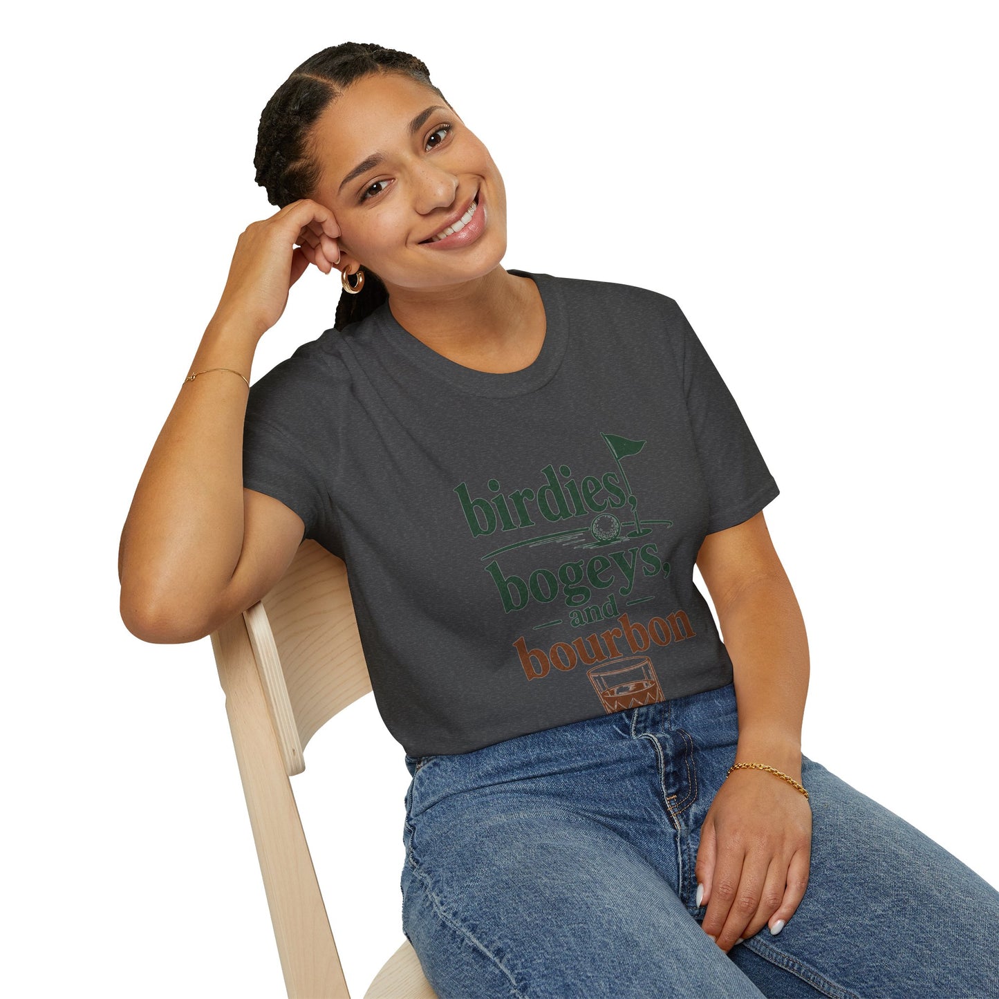 Birdies, Bogeys, and Bourbon Shirt, Dark Heather charcoal, worn by a model seated on a wooden chair