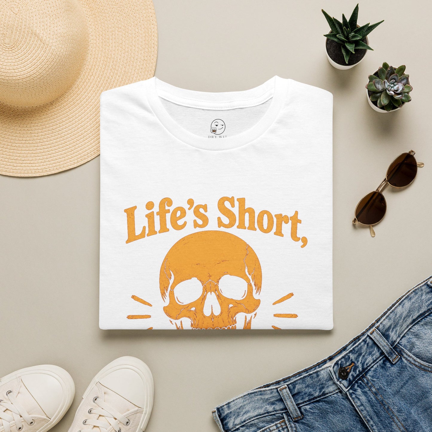 Life's Short, Smile While You Have Teeth Shirt, White, folded flat lay styled with a straw hat, sunglasses, sneakers and denim