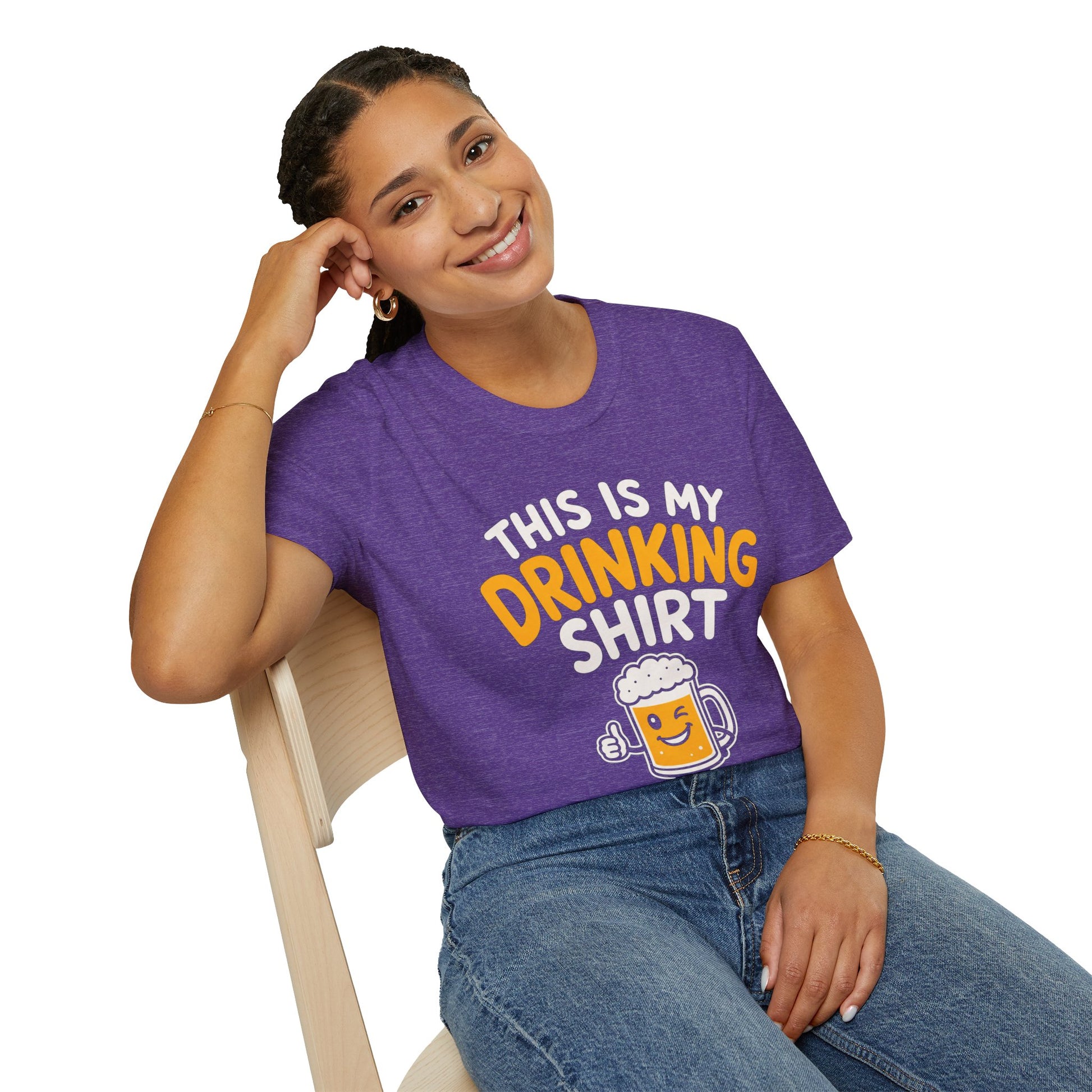 This Is My Drinking Shirt, Heather Purple, worn by a model seated on a wooden chair