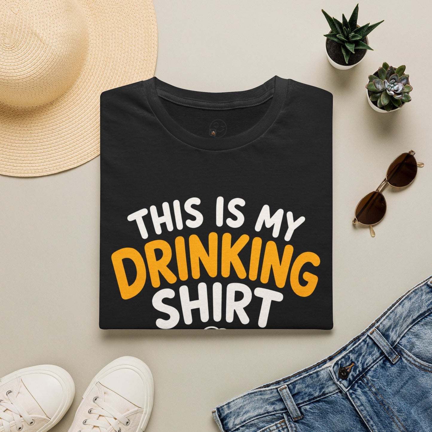 This Is My Drinking Shirt, Black, folded flat lay styled with a straw hat, sunglasses, sneakers and denim