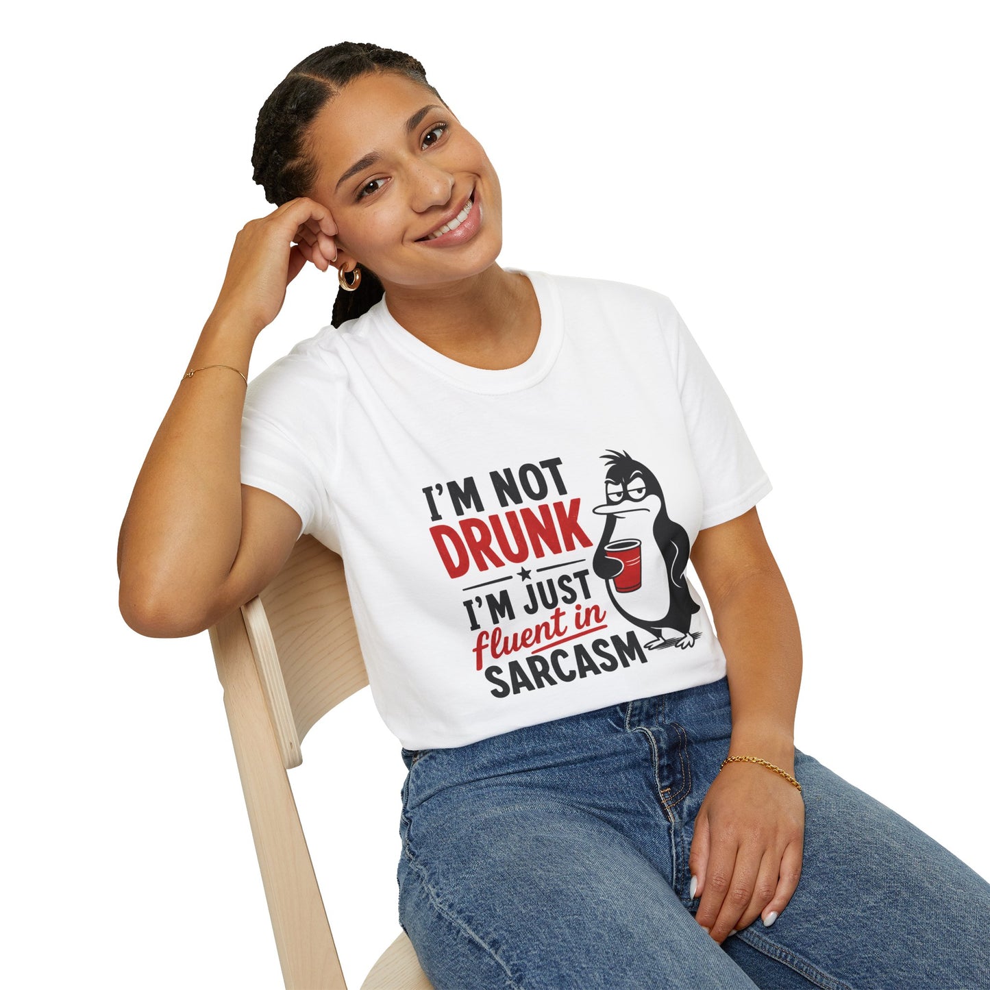 I'm Not Drunk, I'm Just Fluent in Sarcasm Shirt, White, worn by a model seated on a wooden chair